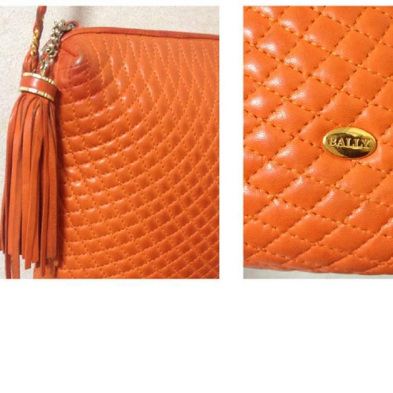 Orange Vintage BALLY orange quilted lamb golden chain shoulder purse with fringes. For Sale