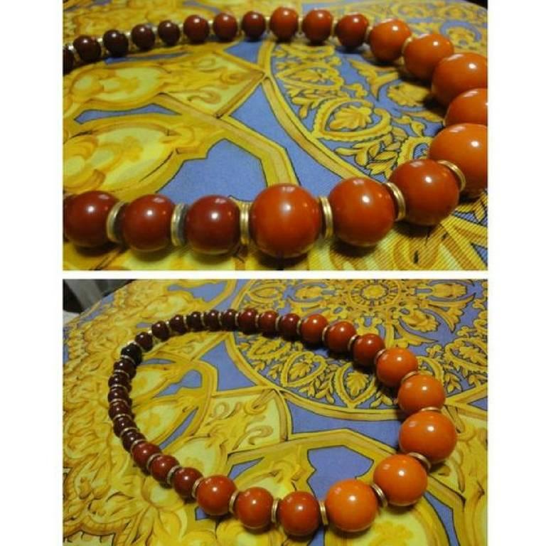 Women's Vintage Yves Saint Laurent orange brown gradation color ball statement necklace.