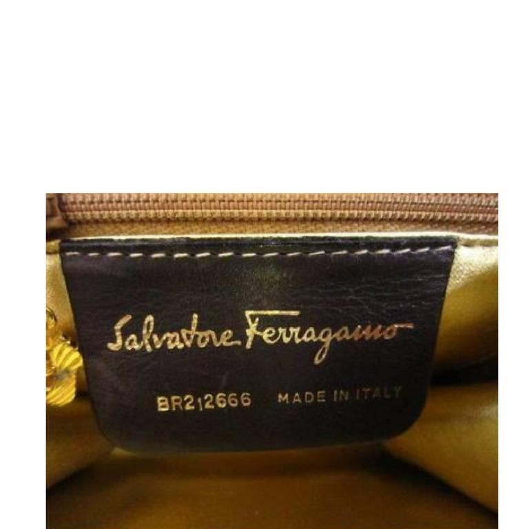 Women's Vintage Salvatore Ferragamo dark brown suede shoulder bag, clutch, gold motifs.