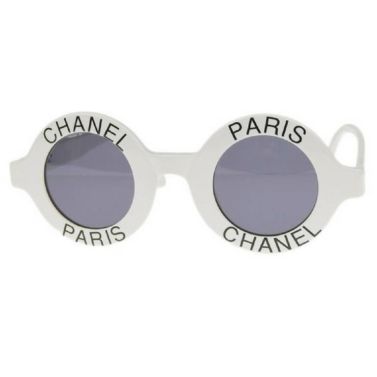 1990s. Vintage CHANEL white round frame sunglasses with black CHANEL PARIS print on it. Must have. One-of-a-kind sunglasses back in the old era.

Retro and mod style are now in trend again! 
This is a vintage CHANEL white round frame sunglasses that