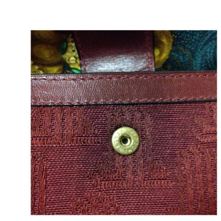 Brown Vintage LANVIN wine logo jacquard and leather wallet with kiss lock coin room. 