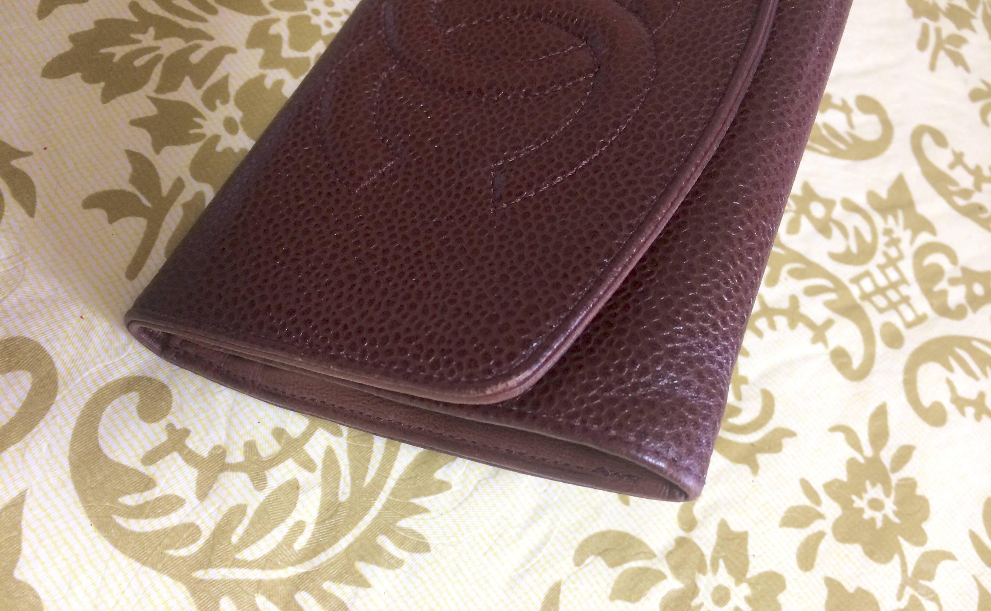 Gray Vintage CHANEL brown caviar leather wallet with large CC stitch mark. Classic.