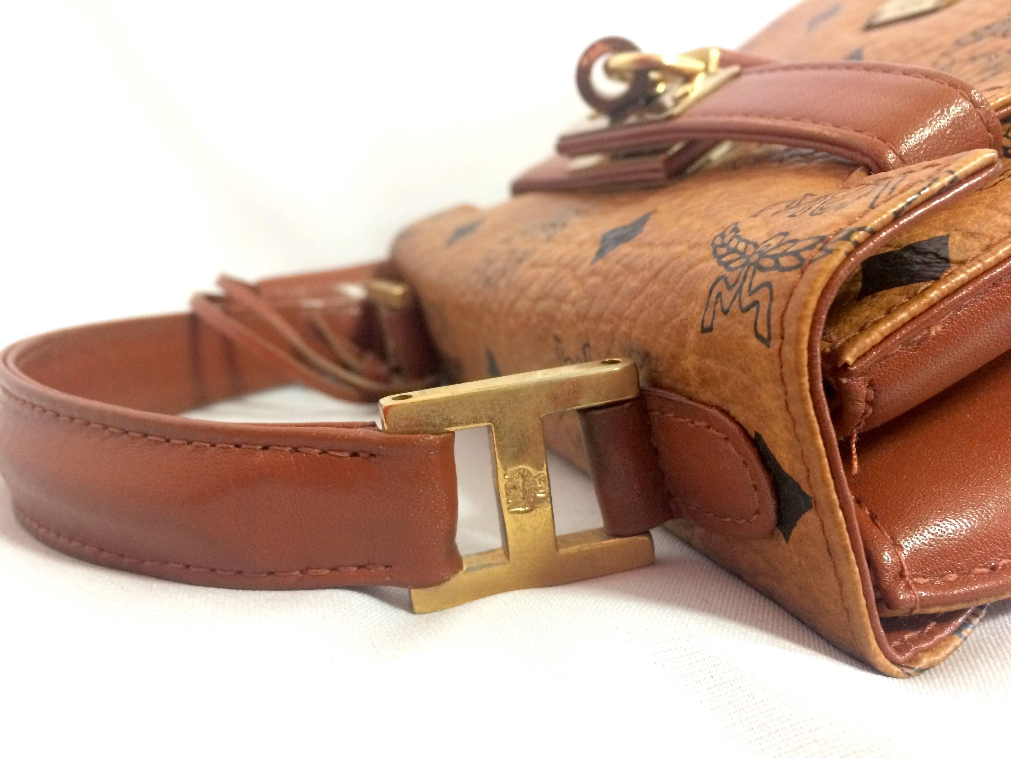 Brown Vintage MCM classic brown mini kelly bag with key, designed by Michael Cromer.