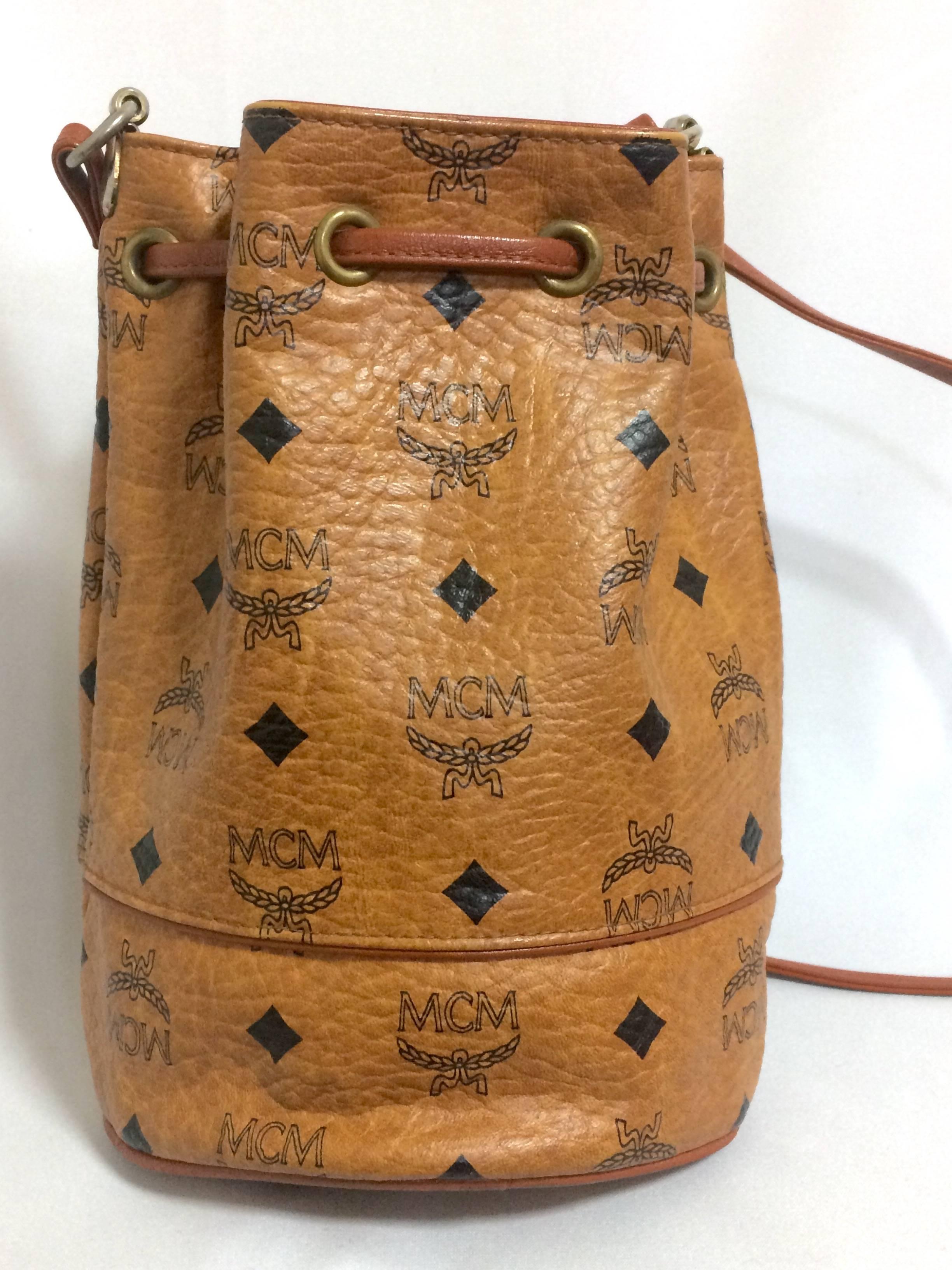 1980s. Vintage MCM brown monogram small hobo bucket bag. mini purse. Made in West Germany. Designed by Michael Cromer.

MCM has been back in the fashion trend again!!
Now it's considered to be one of the must-have designer in fashion.

Introducing a