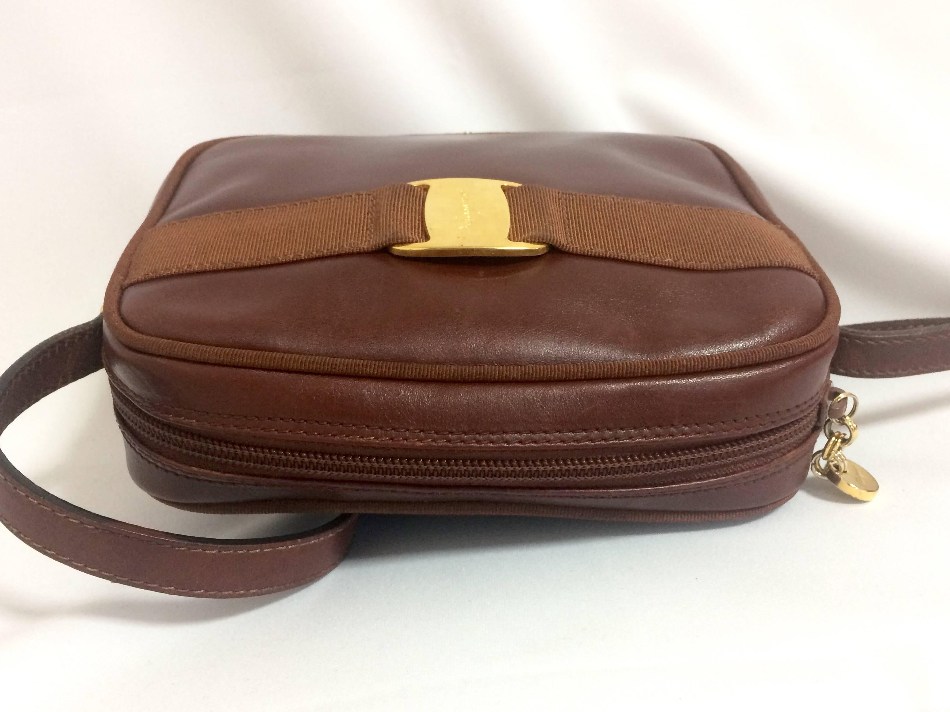 Vintage Salvatore Ferragamo vara collection brown leather purse with logo motif. 1