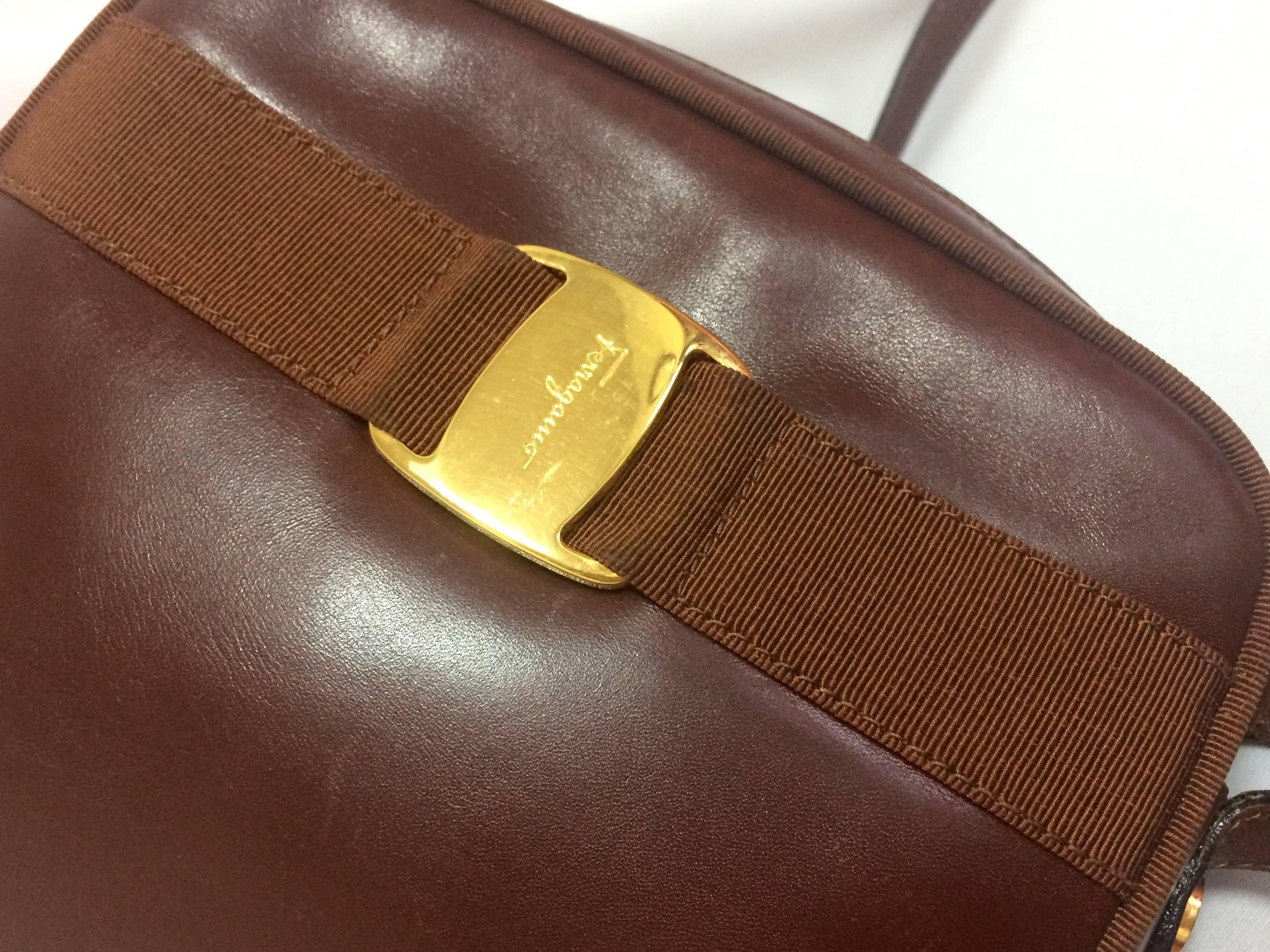 Women's Vintage Salvatore Ferragamo vara collection brown leather purse with logo motif.