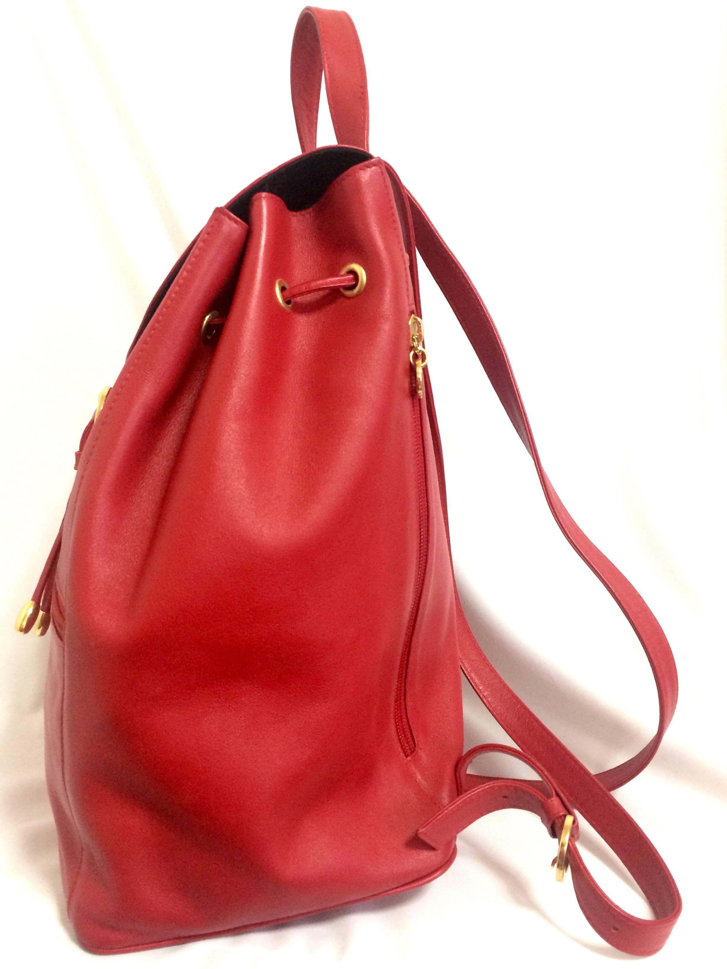 Women's or Men's Vintage Paloma Picasso red leather backpack with golden logo motifs. Classic bag