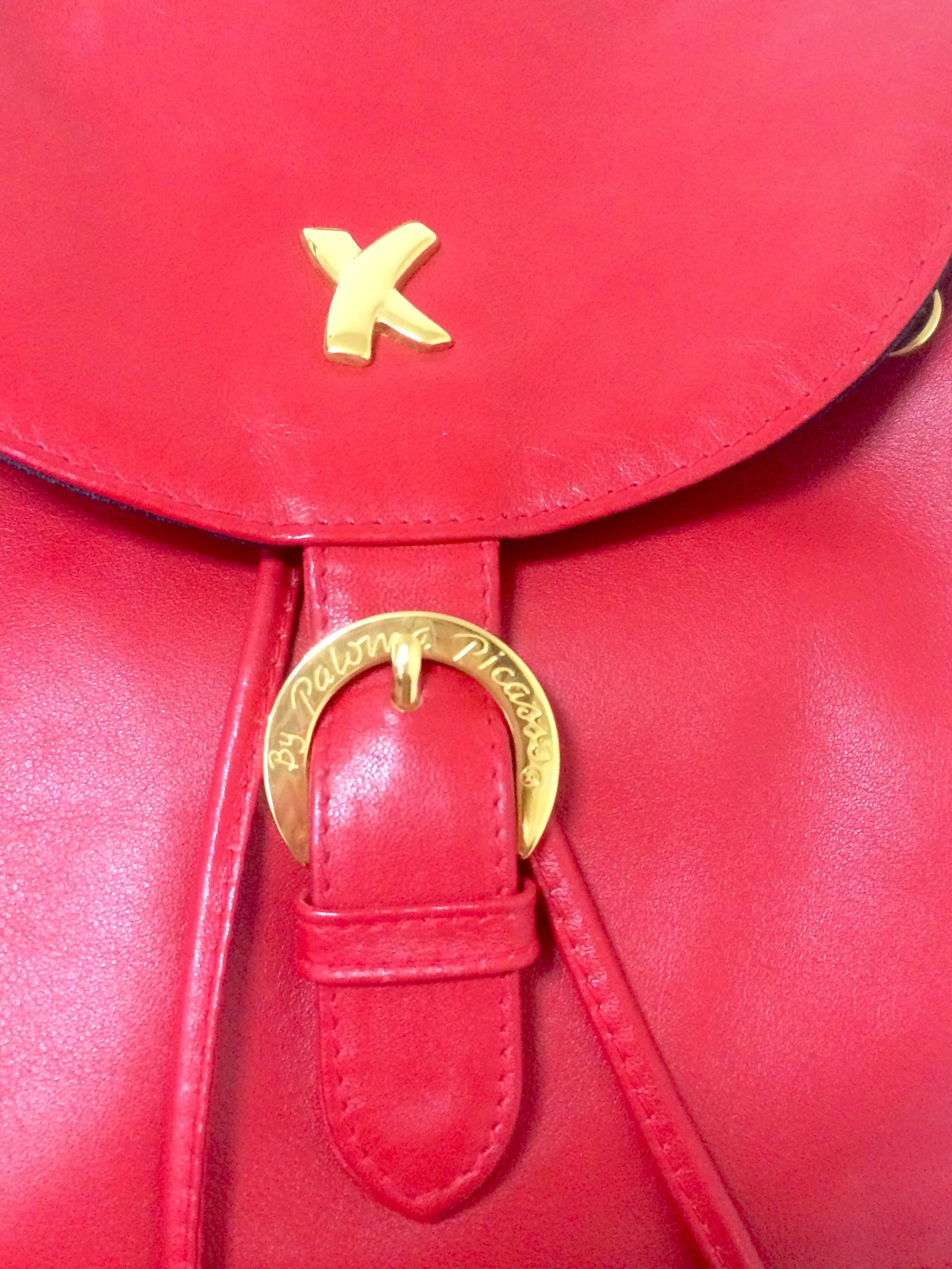 Red Vintage Paloma Picasso red leather backpack with golden logo motifs. Classic bag
