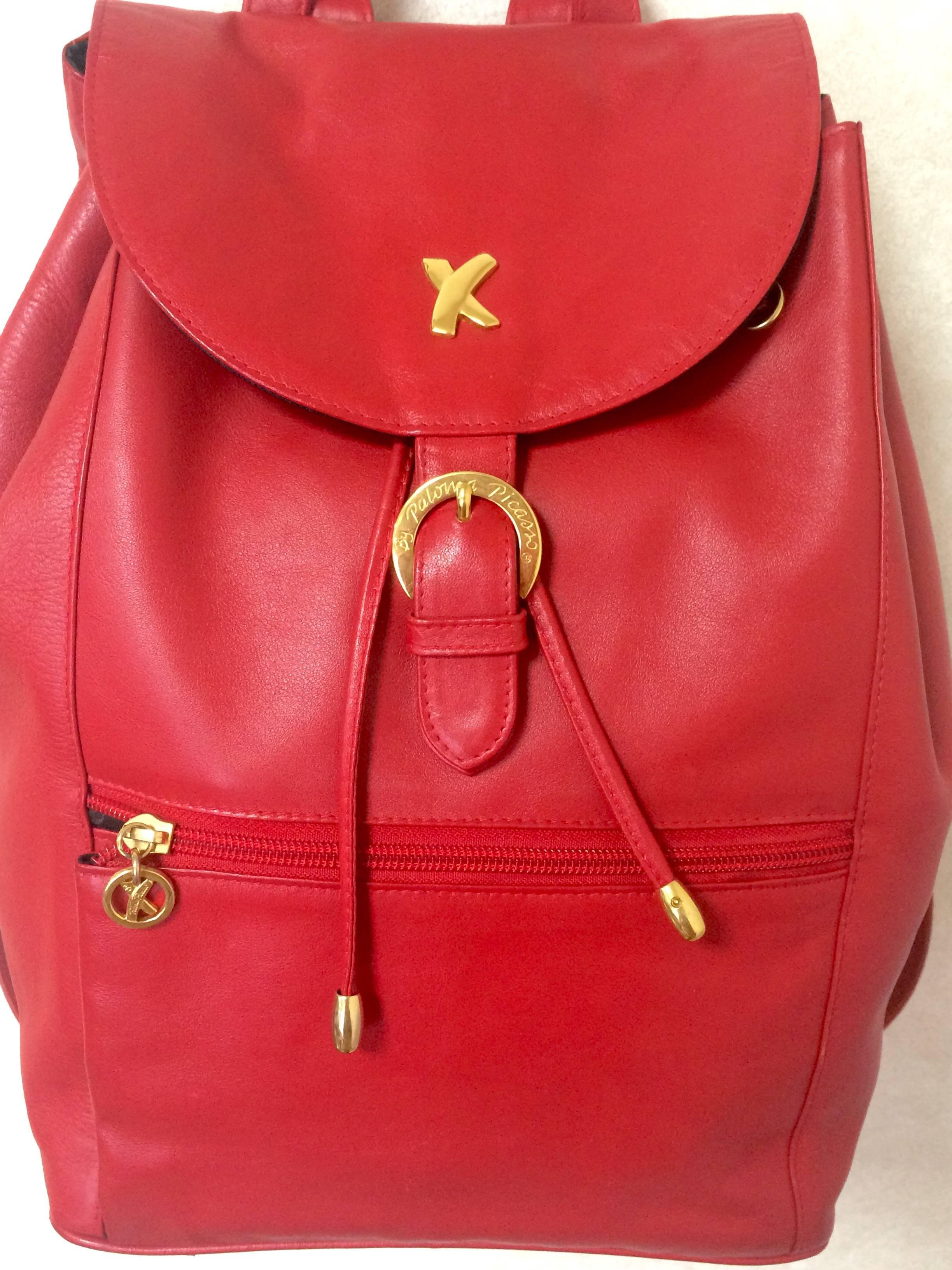 1990s. Vintage Paloma Picasso red leather backpack with golden logo motifs. Classic bag for unisex use.

Introducing a rare masterpiece, red leather backpack from Paloma Picasso back in the 90's. Beautiful red color and condition!

Featuring its
