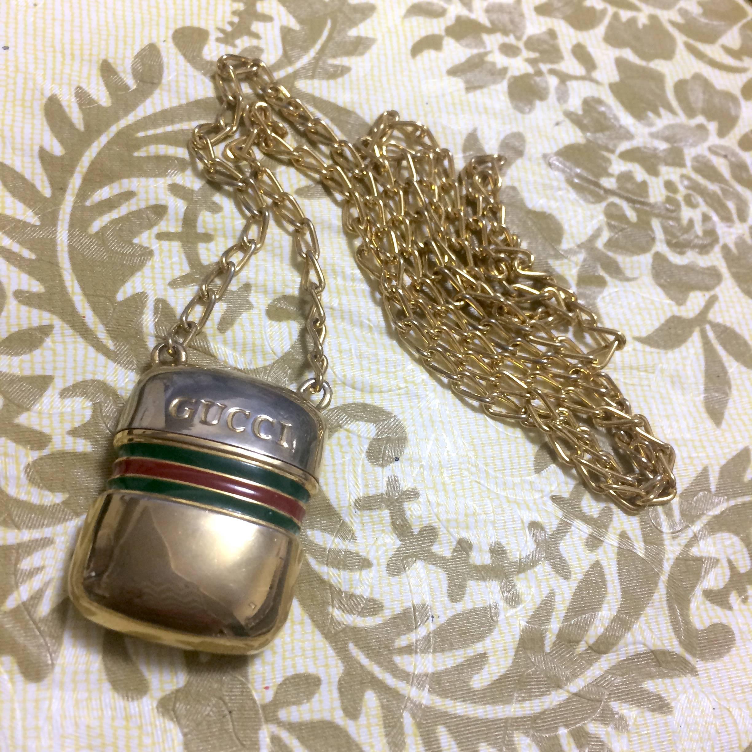 Women's or Men's Vintage Gucci golden mini bottle, pill case design necklace with webbing line. For Sale
