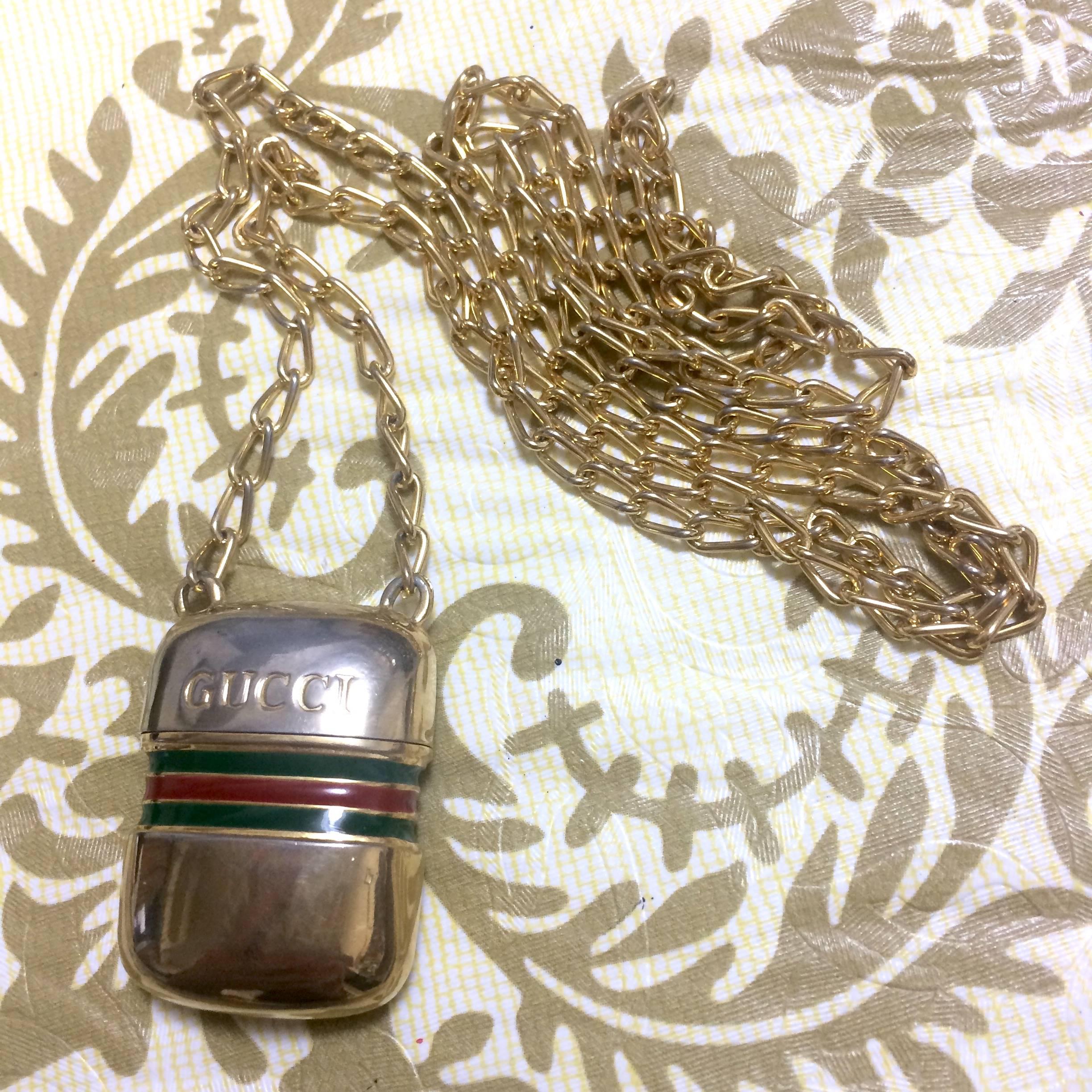 Vintage Gucci golden mini bottle, pill case design necklace with webbing line. For Sale 1