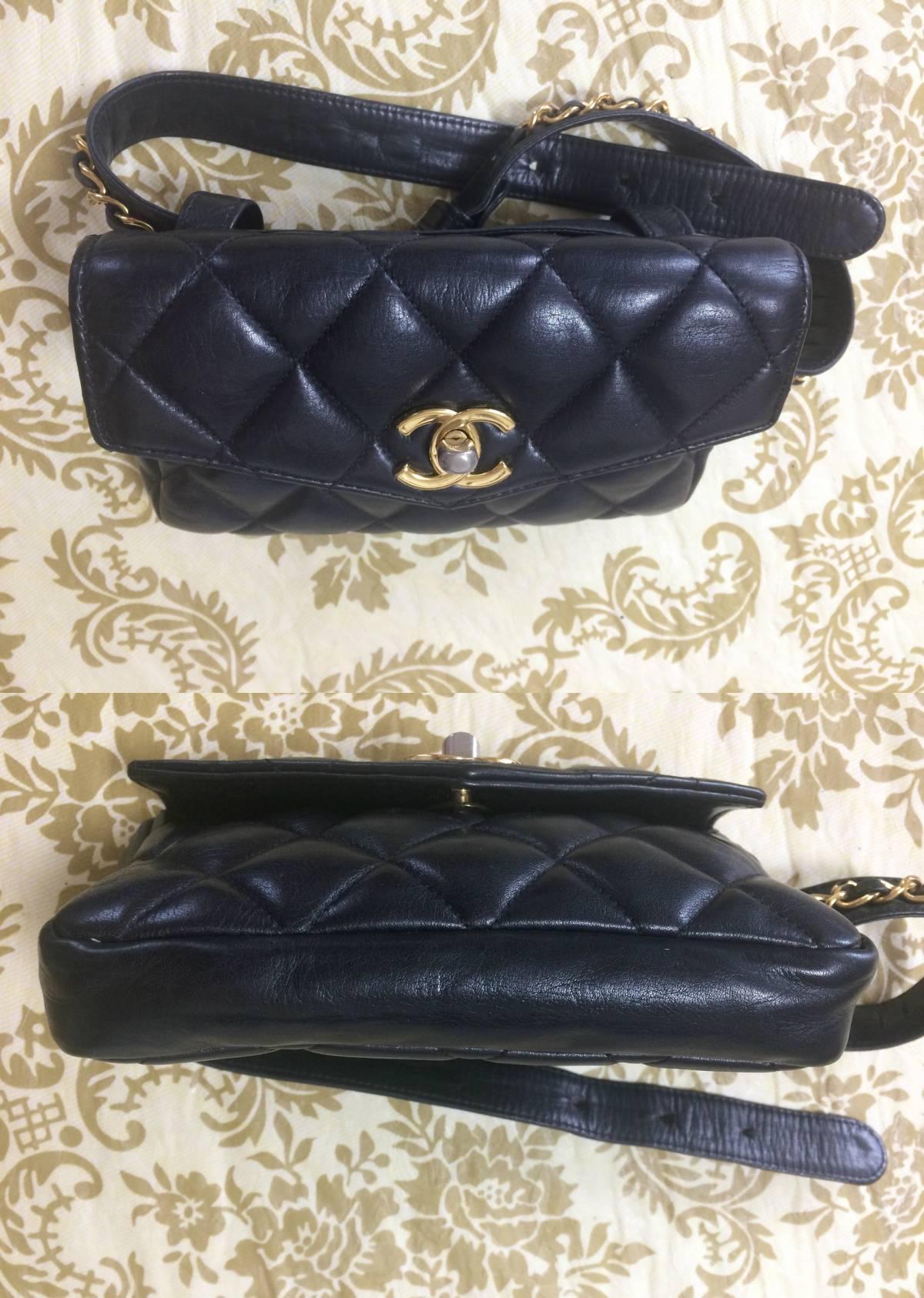 Women's Vintage CHANEL black lamb waist bag, fanny pack with gold chain belt & CC motif.