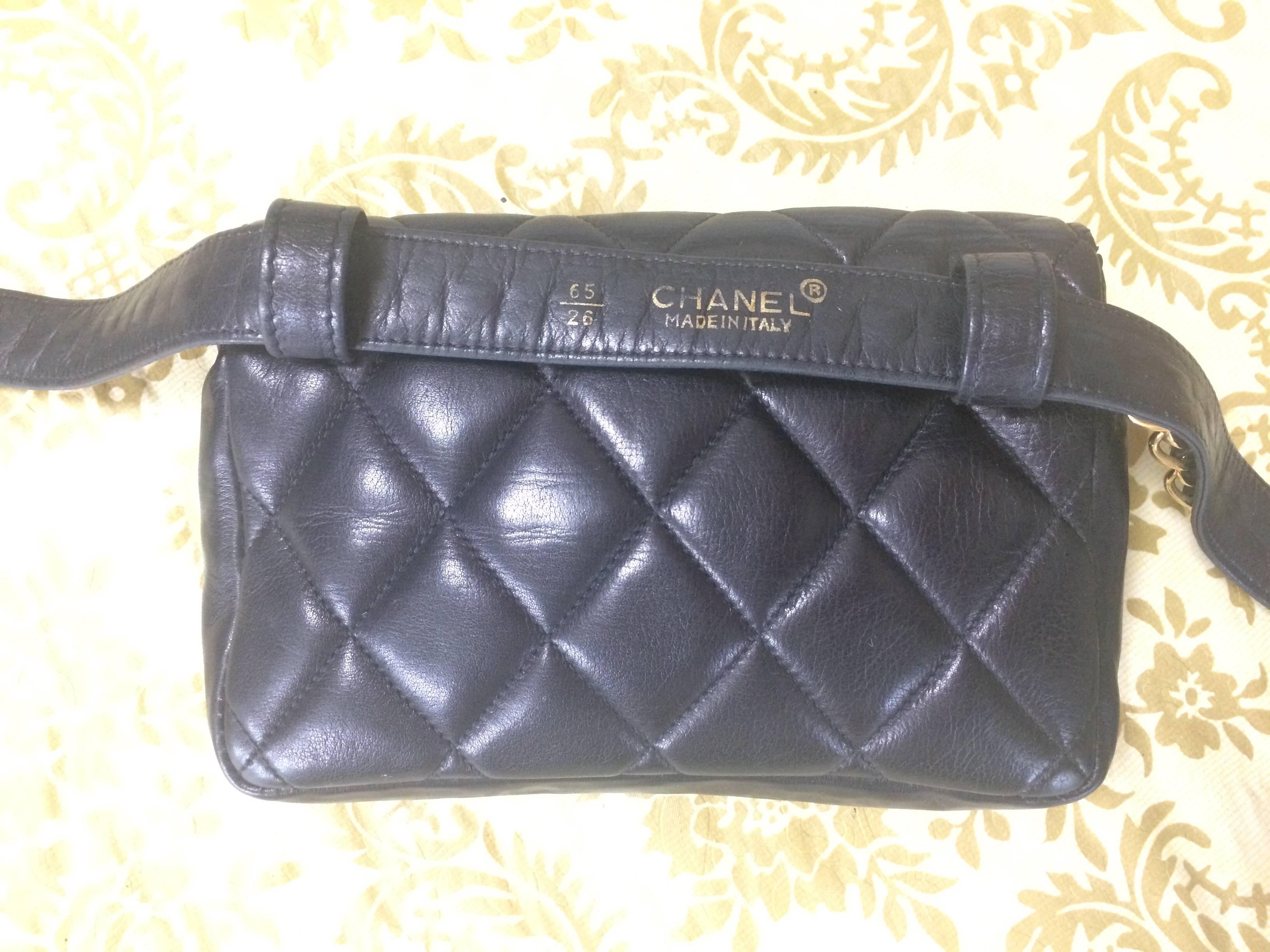 Vintage CHANEL black lamb waist bag, fanny pack with gold chain belt & CC motif. 1