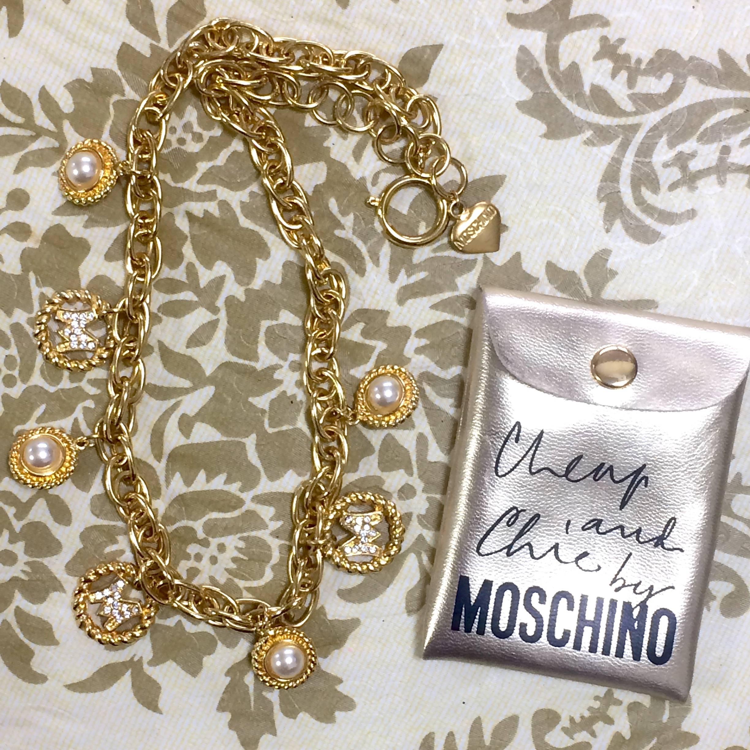 Vintage Moschino statement necklace with golden dangling charms with faux pearls For Sale 1