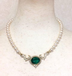 MINT. Vintage Nina Ricci faux pearl necklace with green Swarovski pendant top.