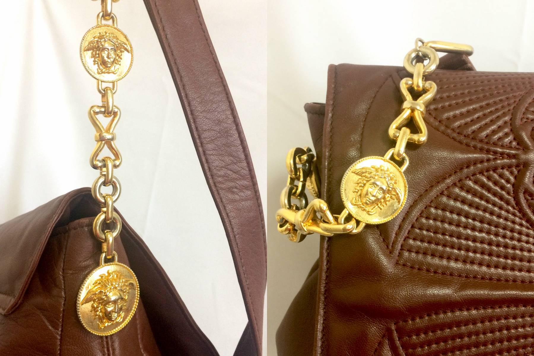 Women's or Men's  Vintage Gianni Versace brown messenger shoulder bag with golden medusa motifs. For Sale