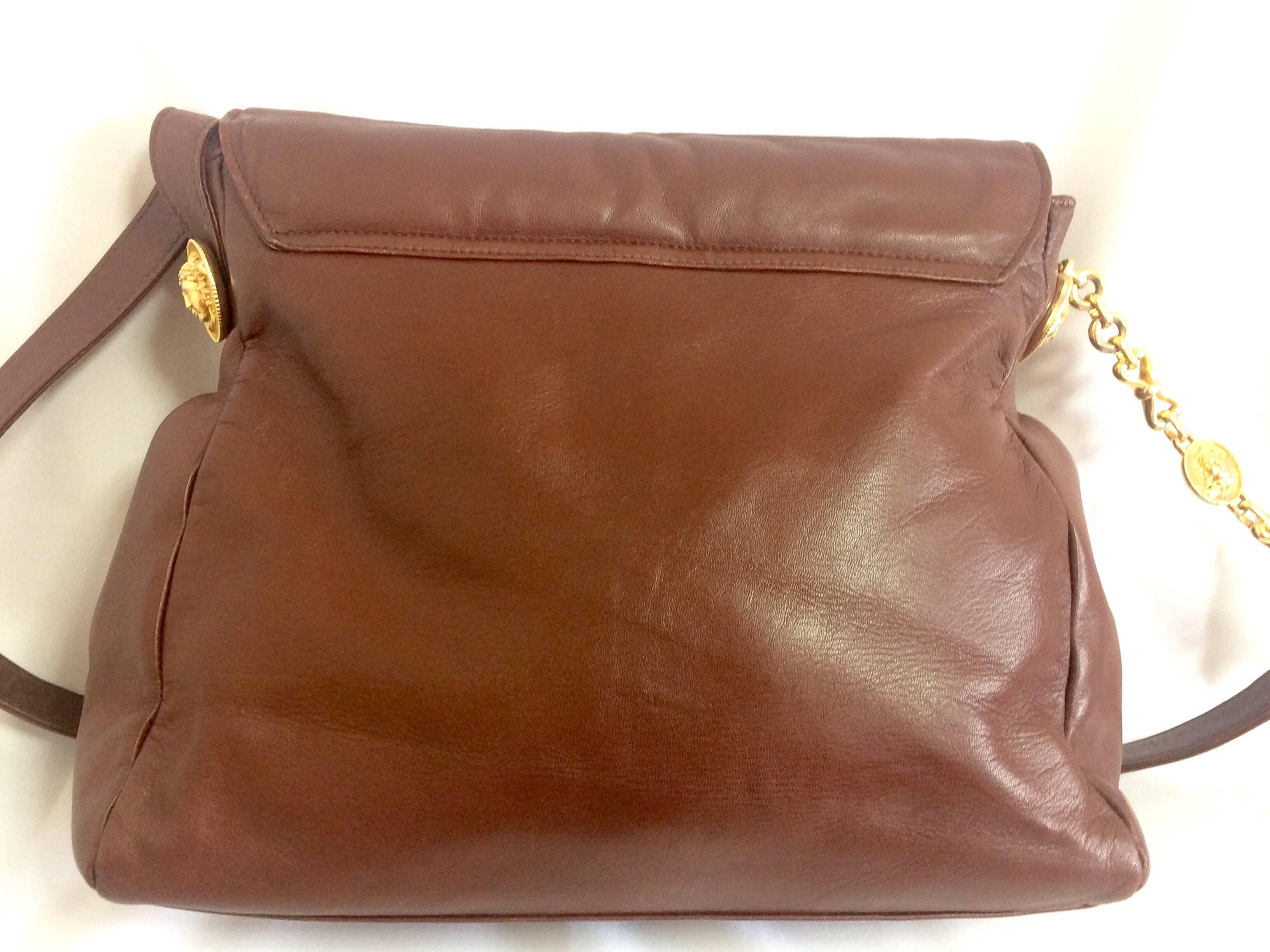 Brown  Vintage Gianni Versace brown messenger shoulder bag with golden medusa motifs. For Sale
