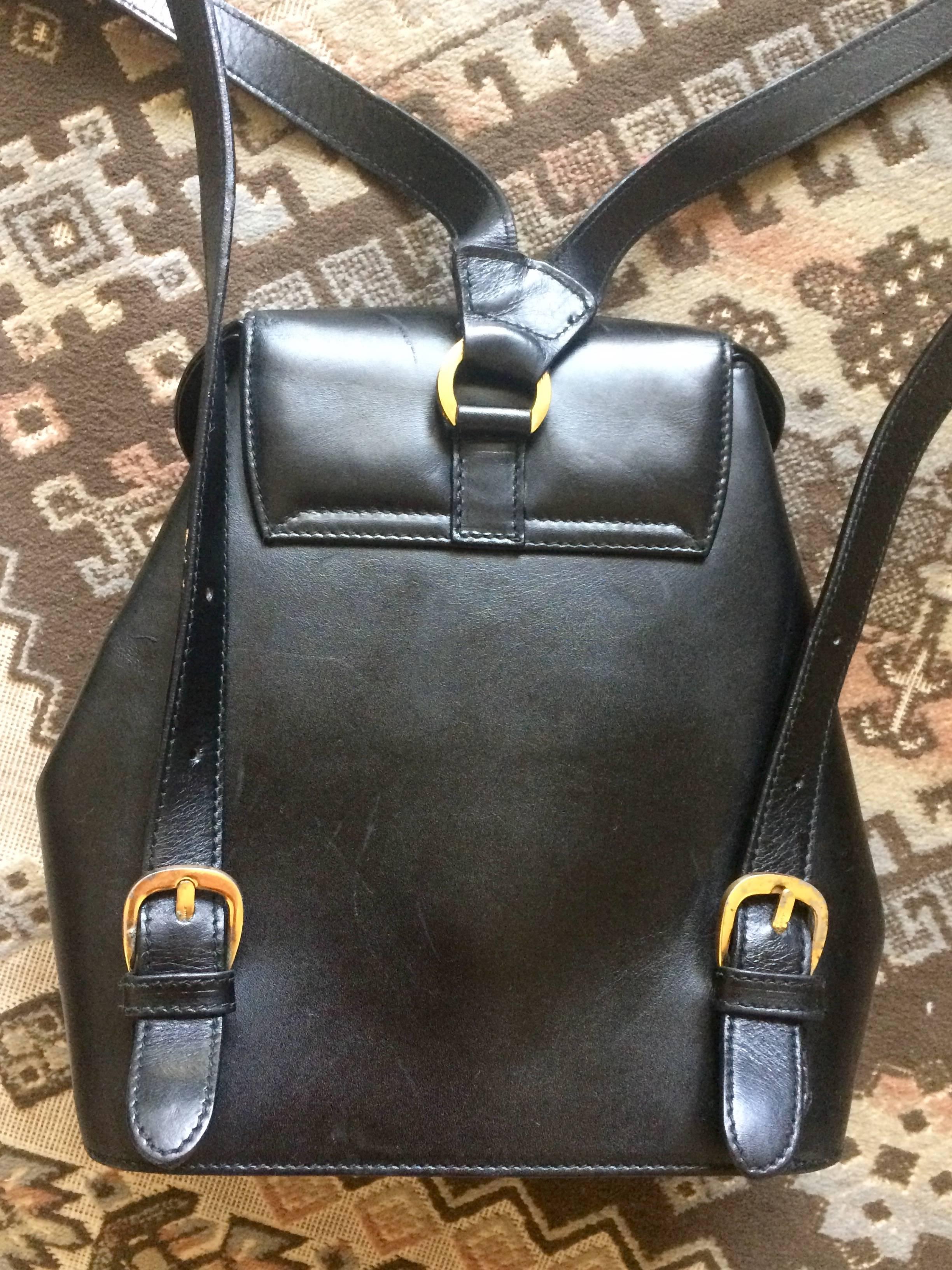 Black Vintage Salvatore Ferragamo black calf leather backpack with golden motif