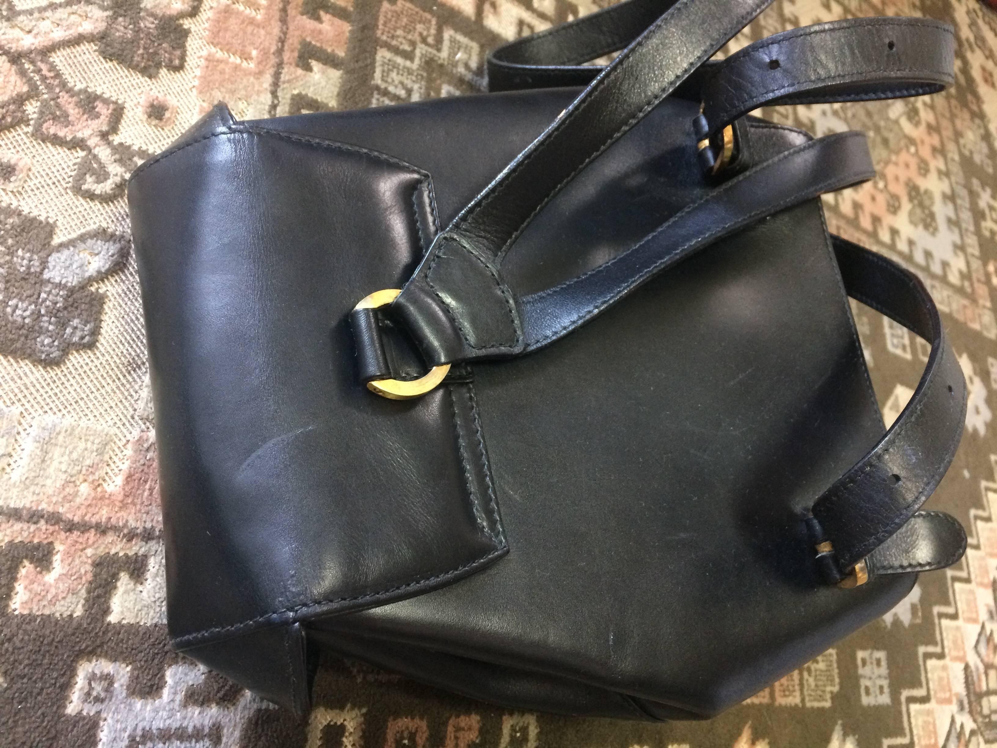 Vintage Salvatore Ferragamo black calf leather backpack with golden motif In Good Condition In Kashiwa, Chiba