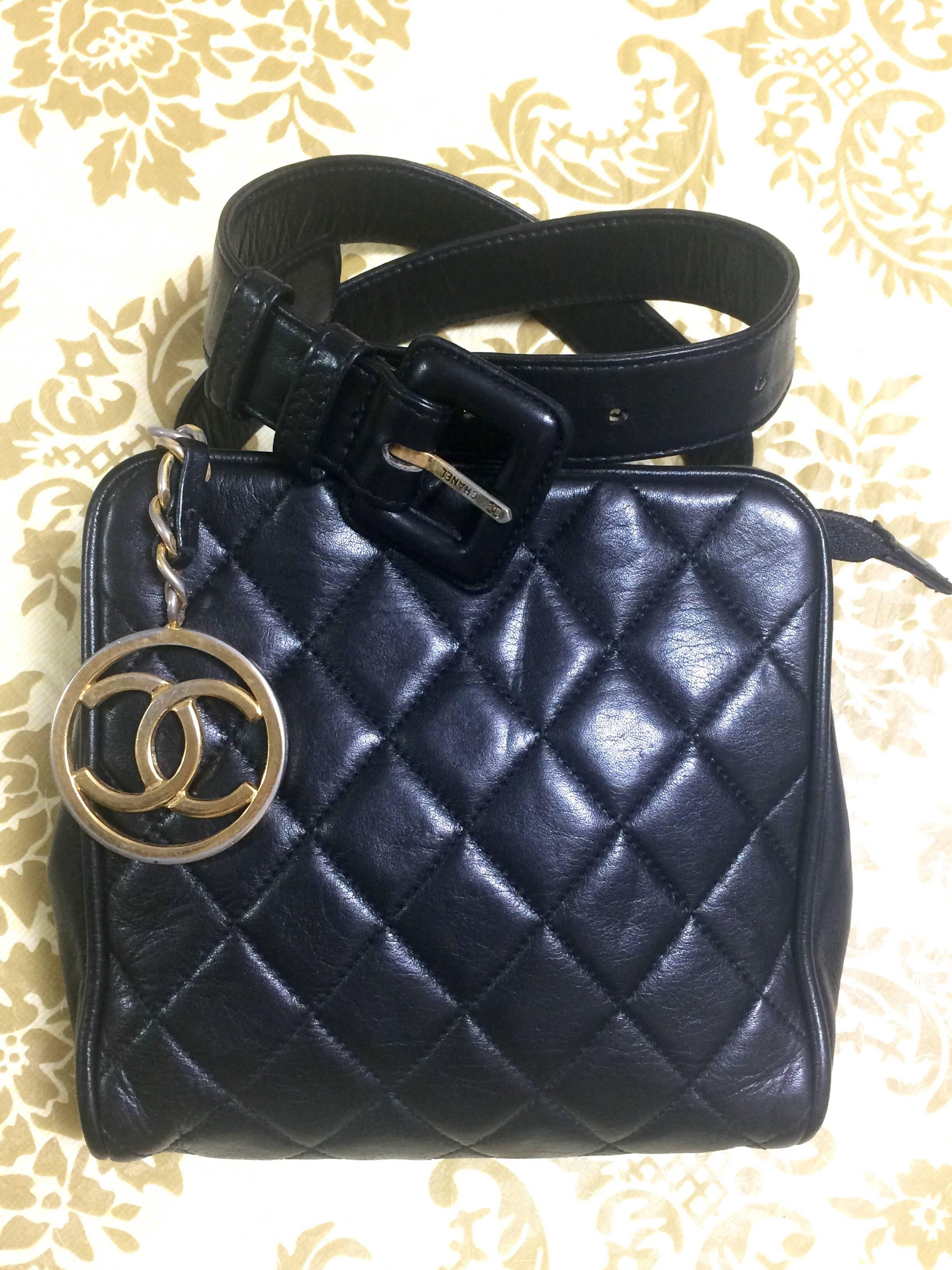 1990s. Vintage CHANEL black lamb leather oval flap waist purse, fanny pack with CC closure hock. 26.5" through 30".(67cm to 76cm)

Vintage CHANEL black leather square shape waist purse, fanny bag with a matching belt and CC dangling