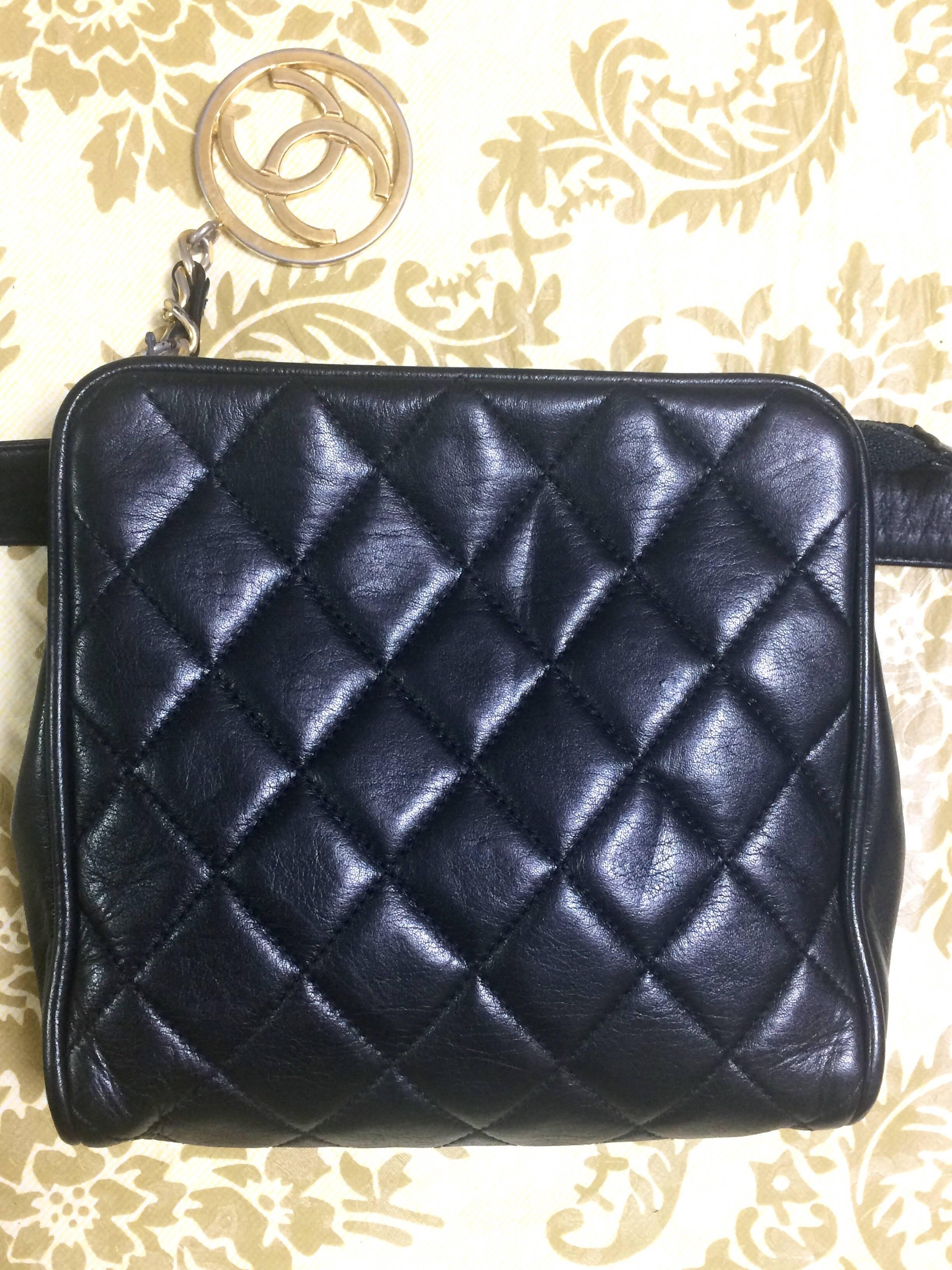 Black Vintage CHANEL black lambskin square shape waist purse, fanny pack with gold CC.