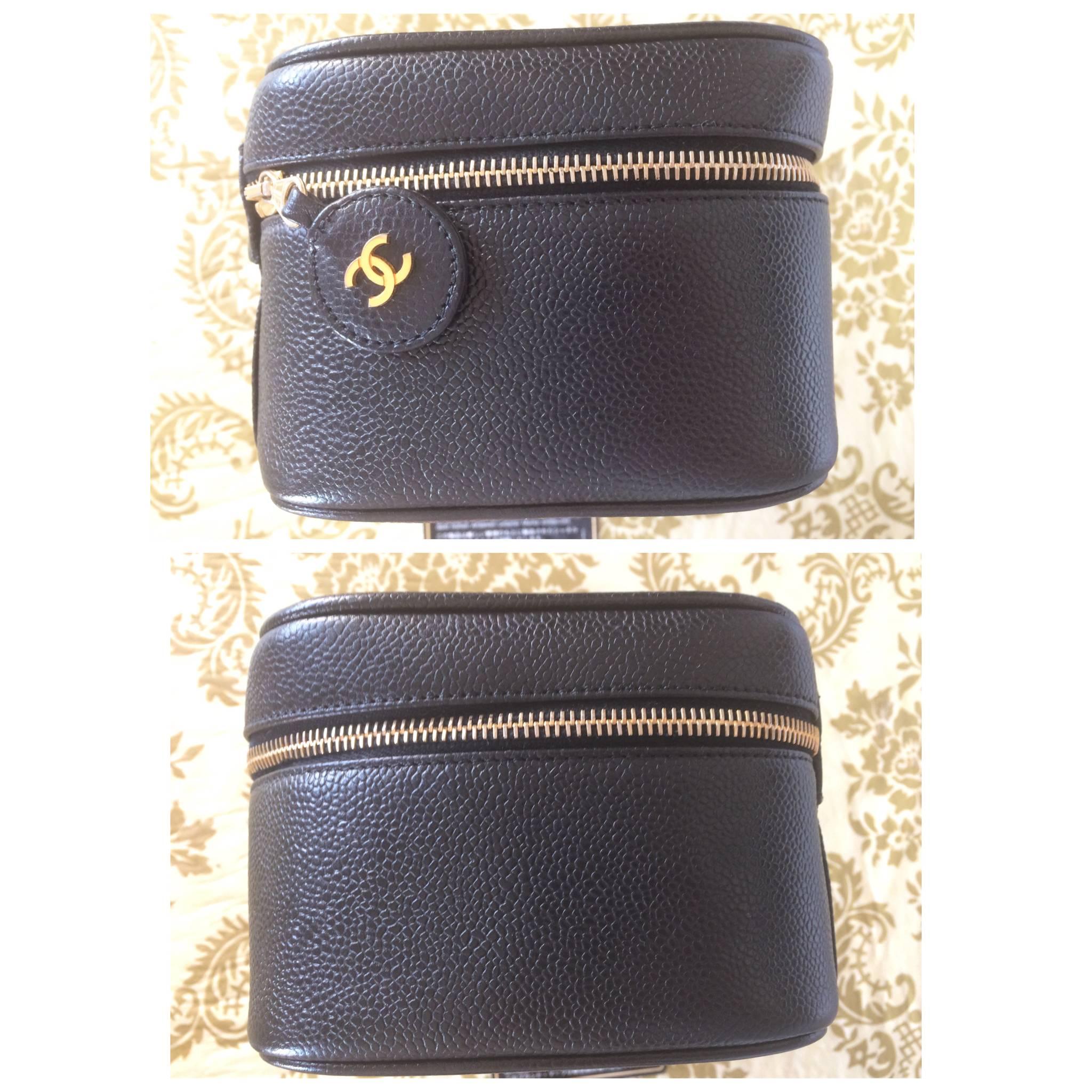Black Vintage CHANEL black caviar cosmetic case, vanity bag, mini purse with CC mark.