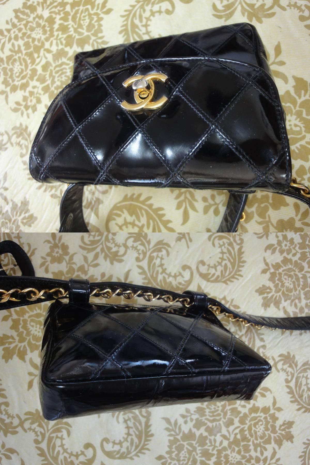 Women's Vintage CHANEL black patent enamel waist purse, fanny pack with gold chain belt.
