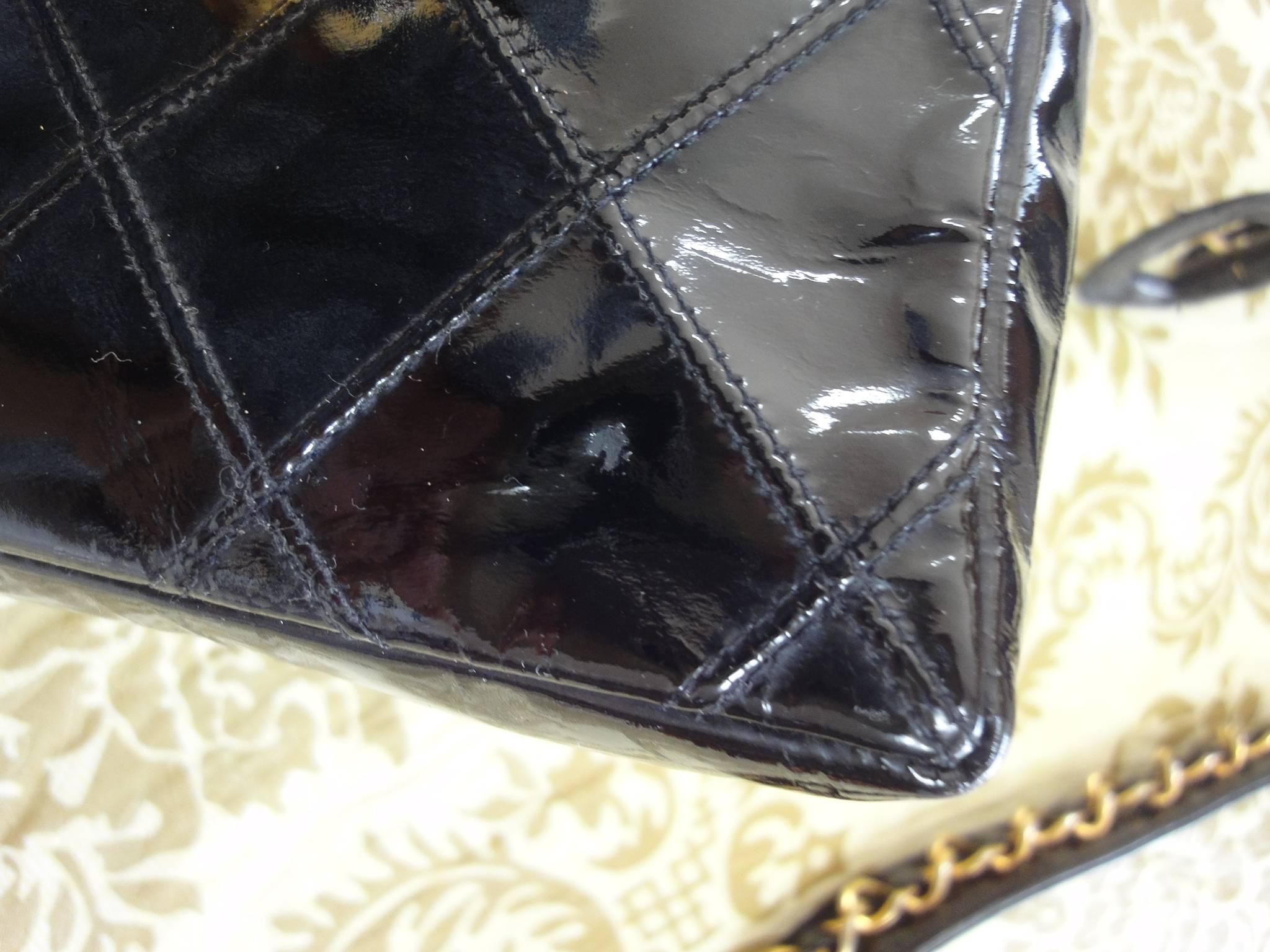 Black Vintage CHANEL black patent enamel waist purse, fanny pack with gold chain belt.