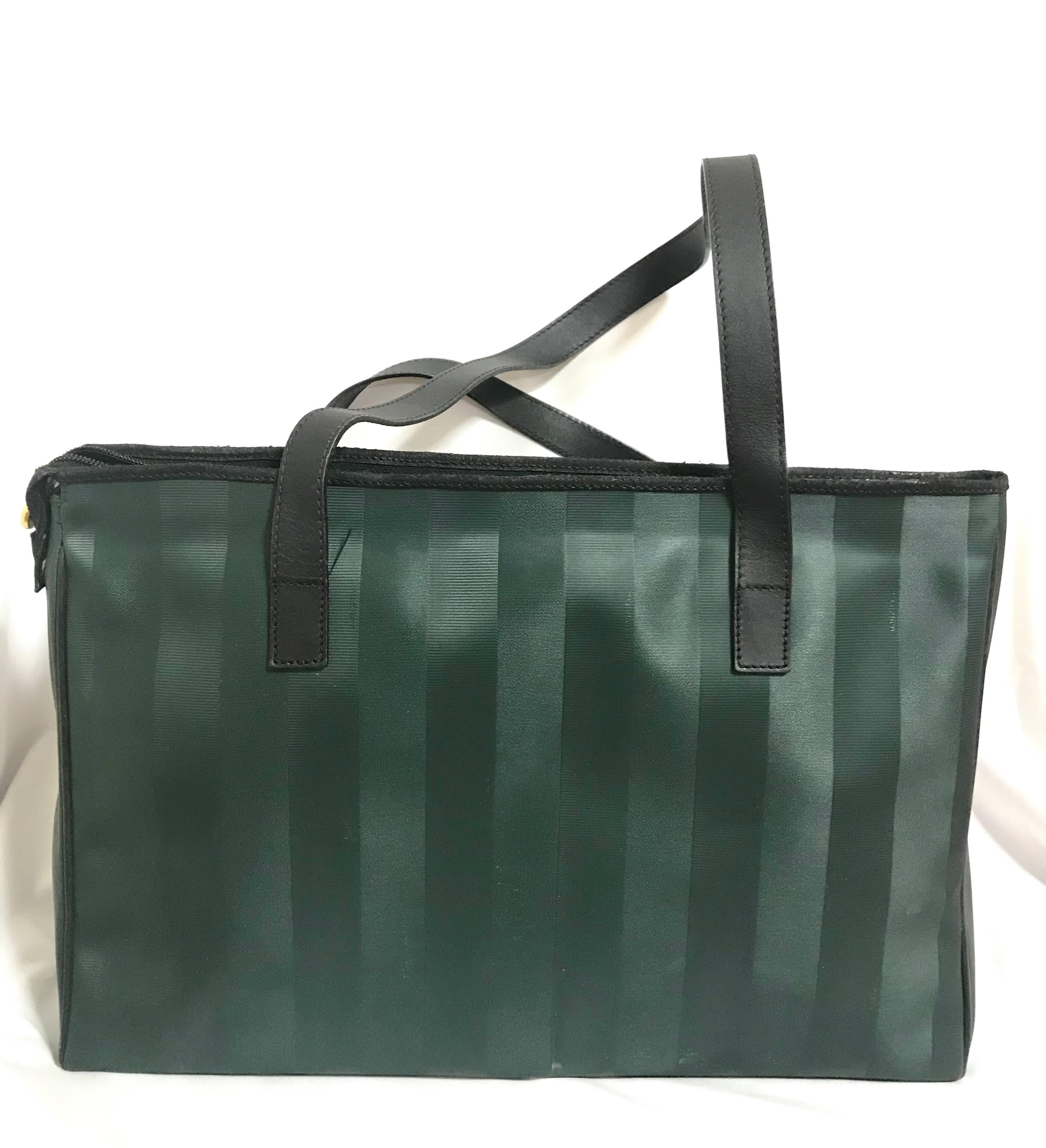 1990s. Vintage FENDI classic deep green pecan stripe pattern large shopper tote bag with black leather handles. Daily use purse for Unisex.

For all Fendi vintage lovers, this purse is the one for you!

Very chic and cute shopper tote from FENDI