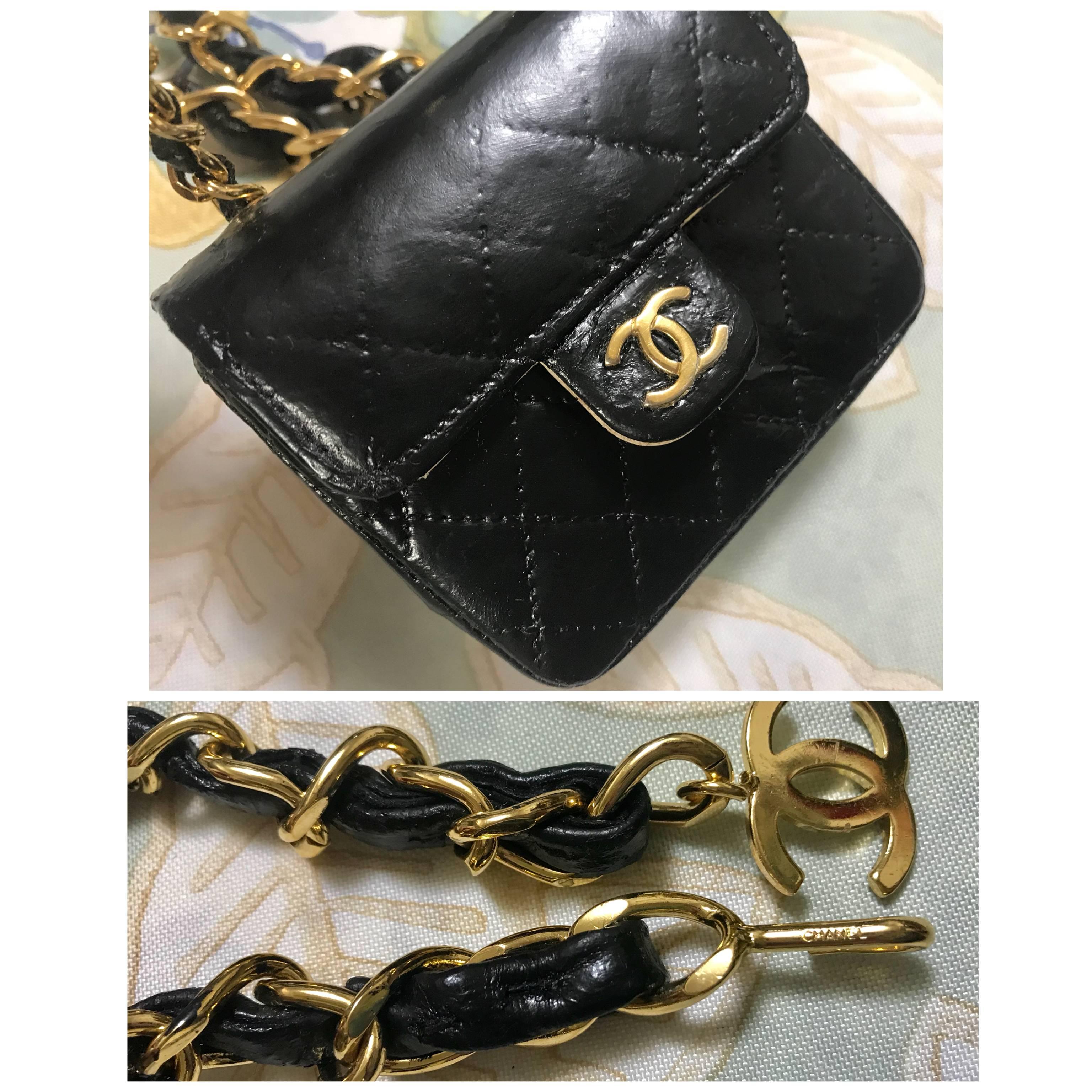 Black Vintage CHANEL mini 2.55 bag charm chain leather belt with golden CC charm.