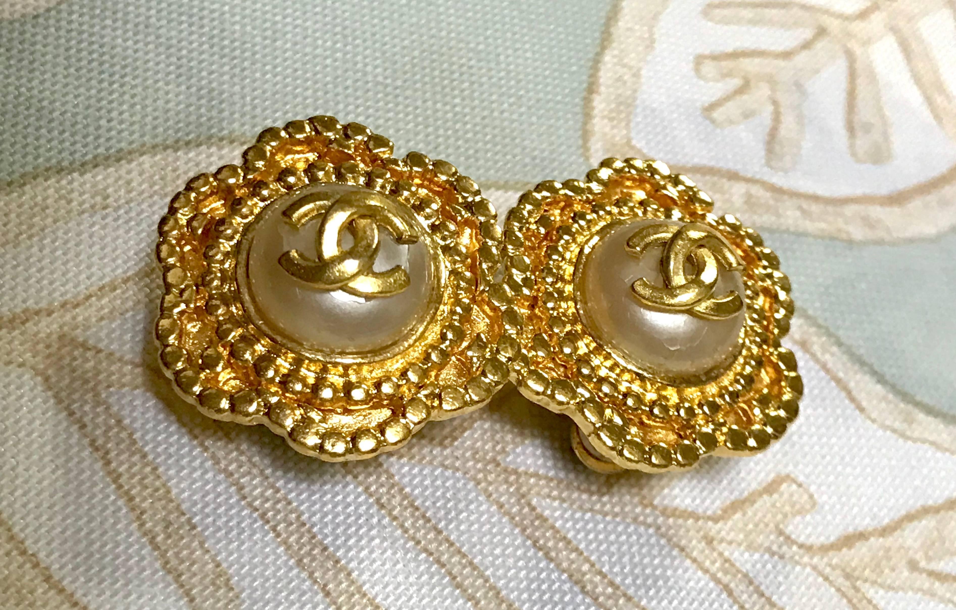 Vintage CHANEL golden six petal flower design earrings. CC mark and faux pearl.  1