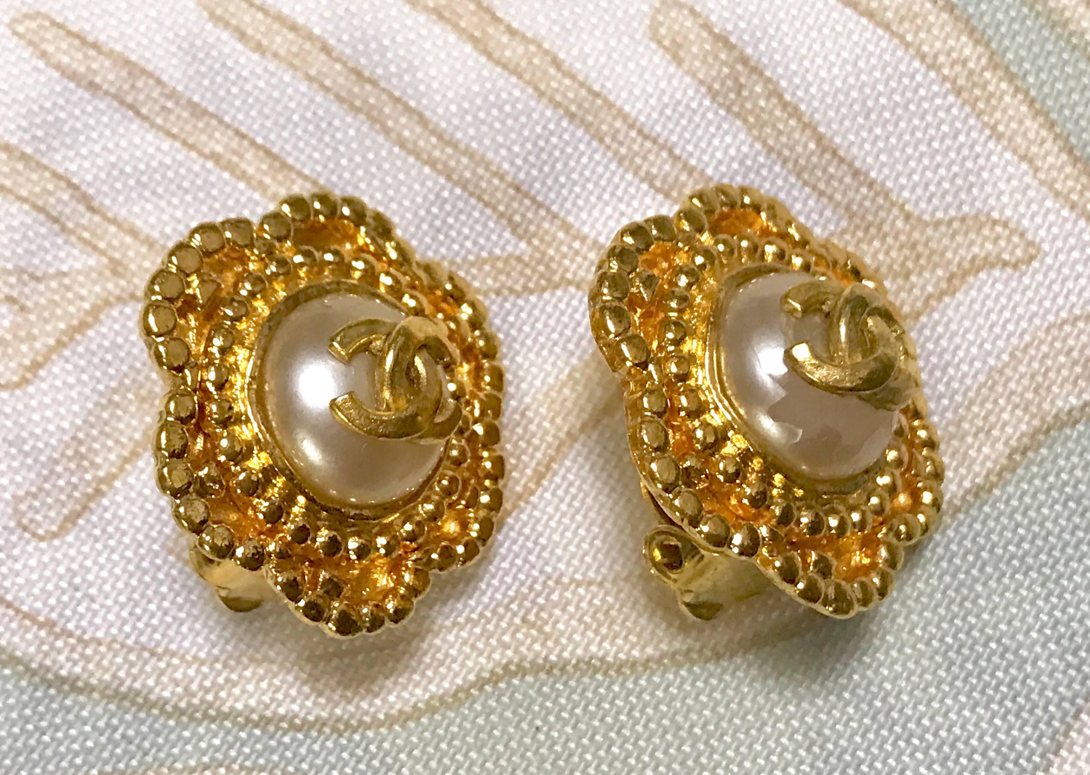 Women's Vintage CHANEL golden six petal flower design earrings. CC mark and faux pearl. 