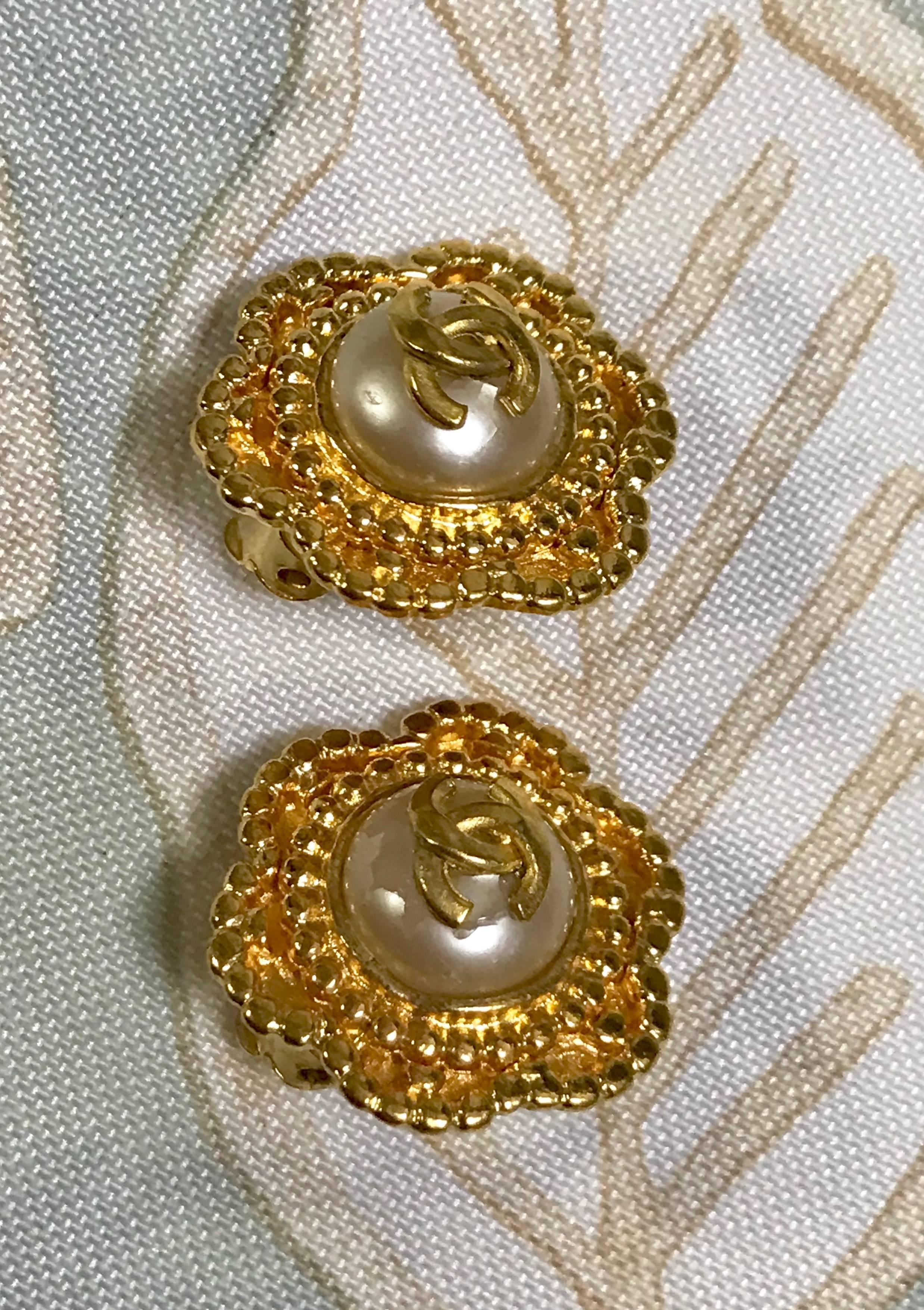 Vintage CHANEL golden six petal flower design earrings. CC mark and faux pearl.  2