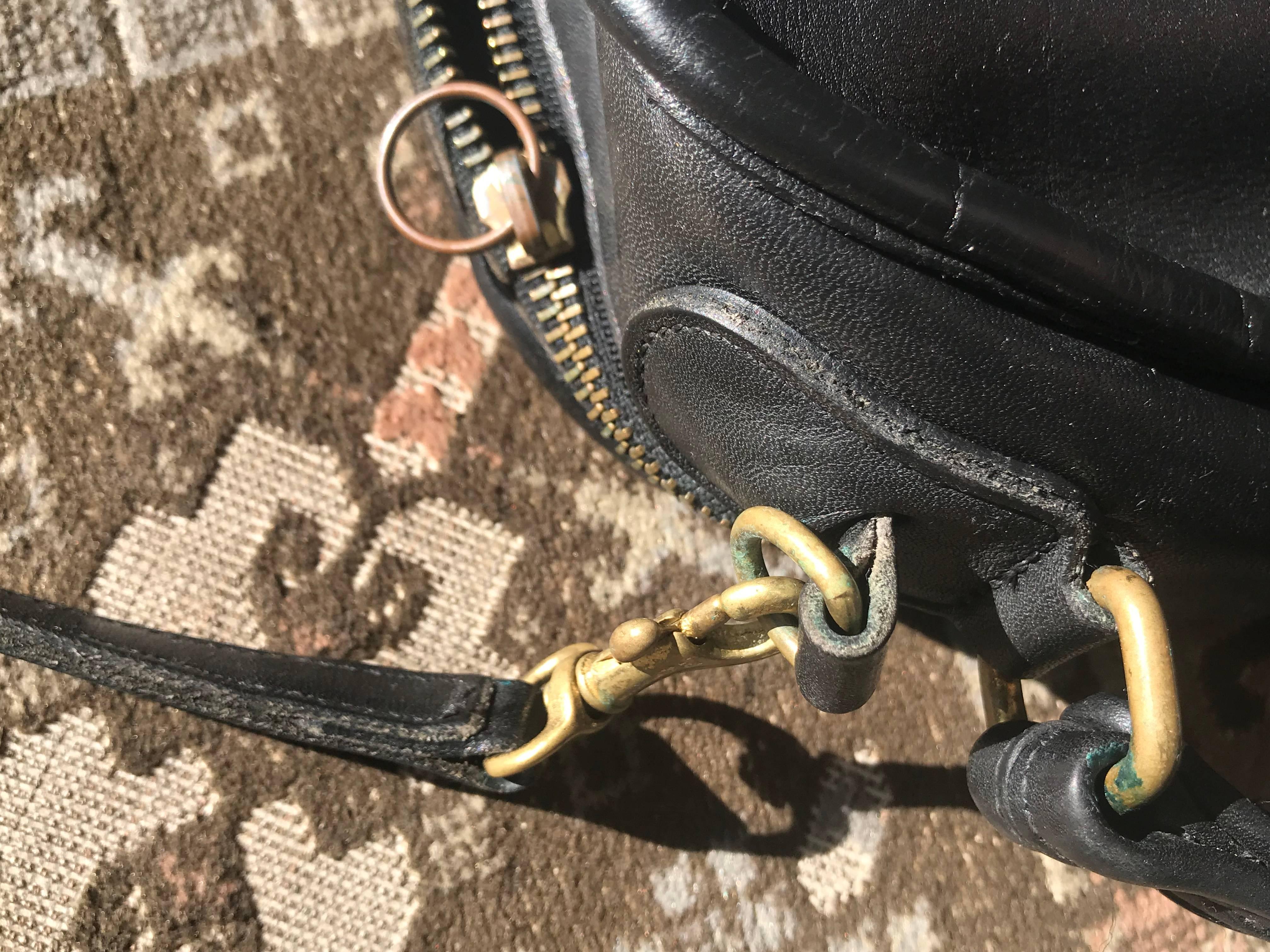 Black Vintage COACH genuine black leather oval lunchbox shape shoulder bag. USA made.