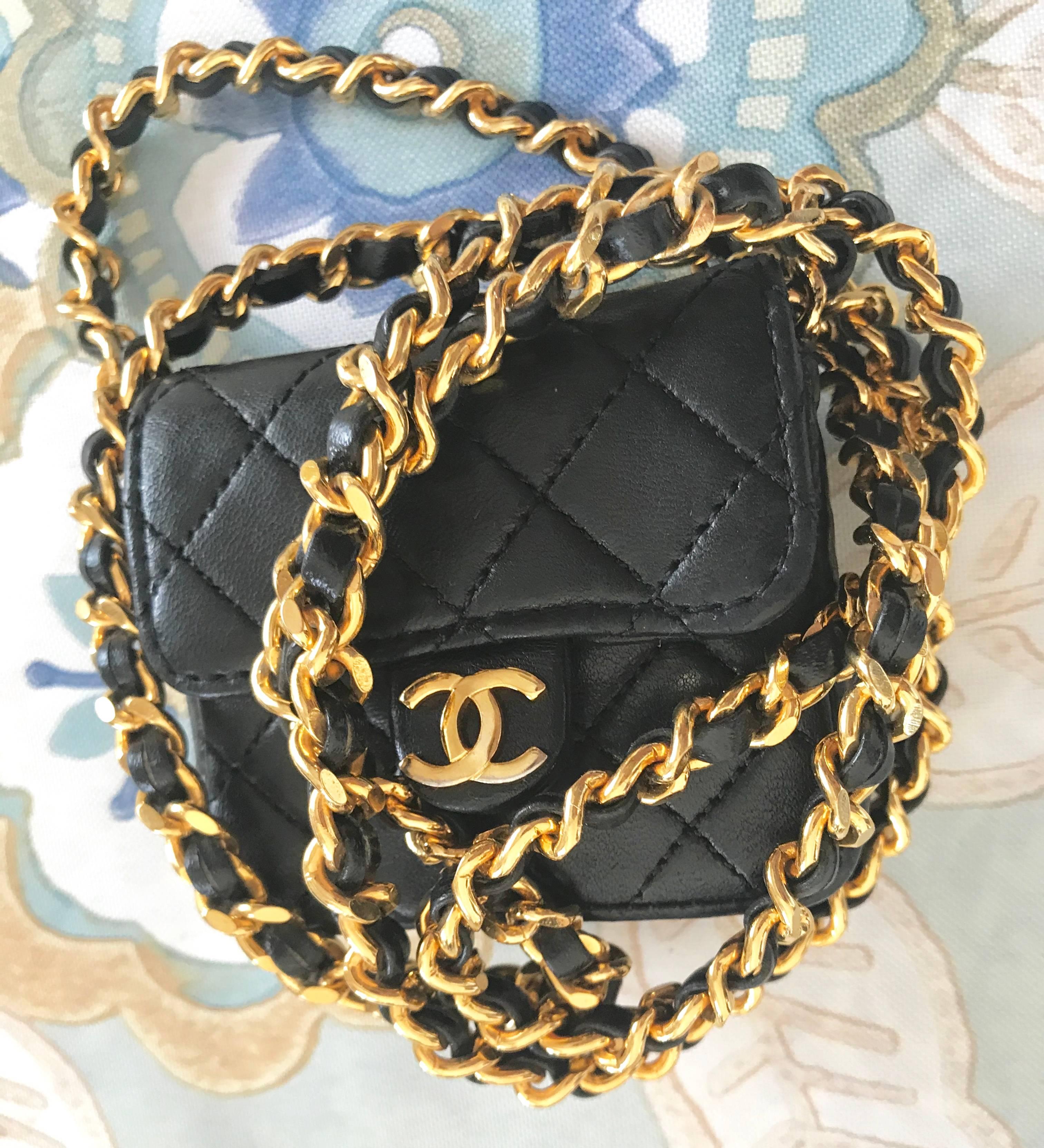 Black Vintage Chanel black mini 2.55 bag/necklace with long chain and leather strap.