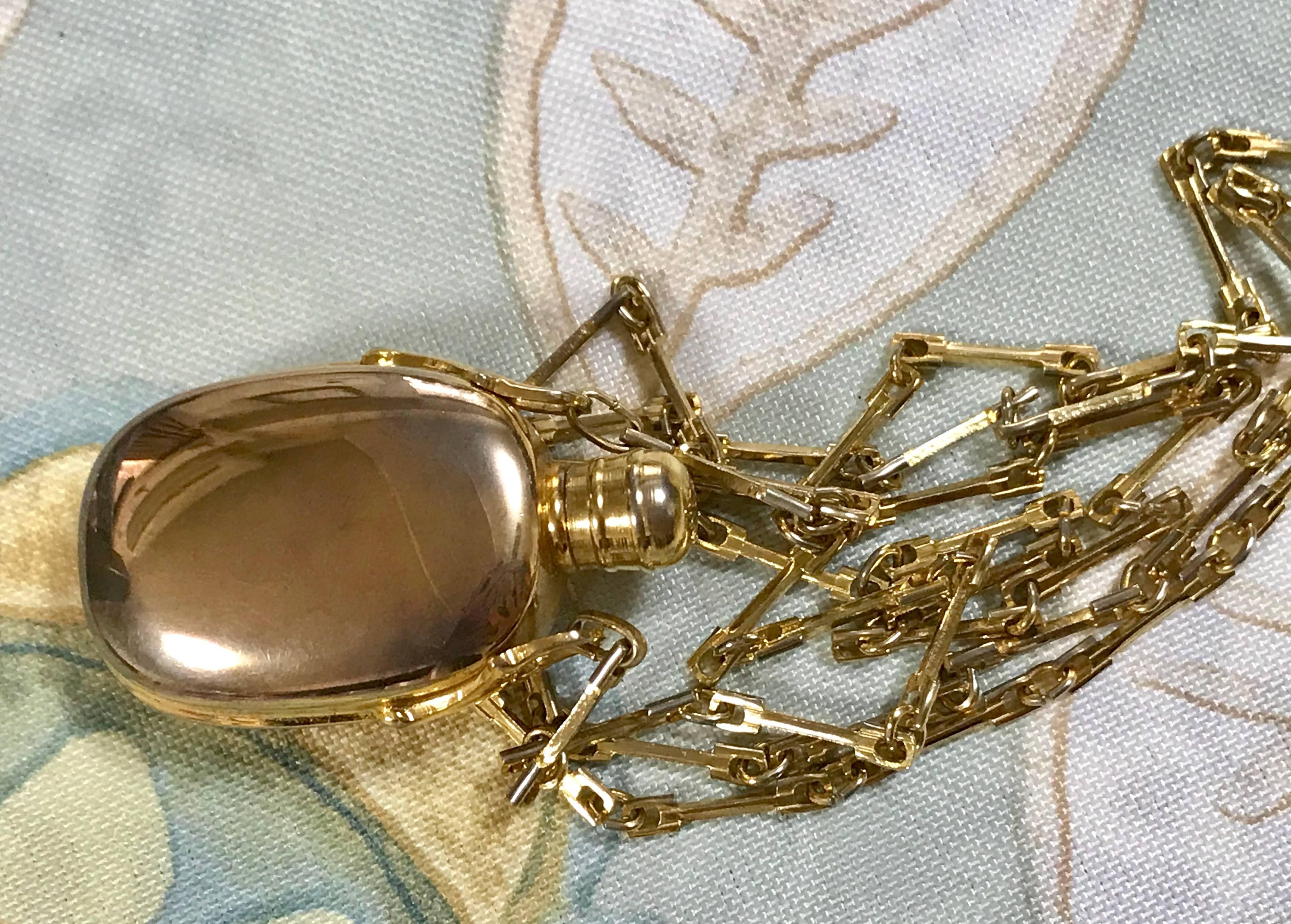 Vintage Gucci golden perfume bottle necklace with logo mark on top.  3