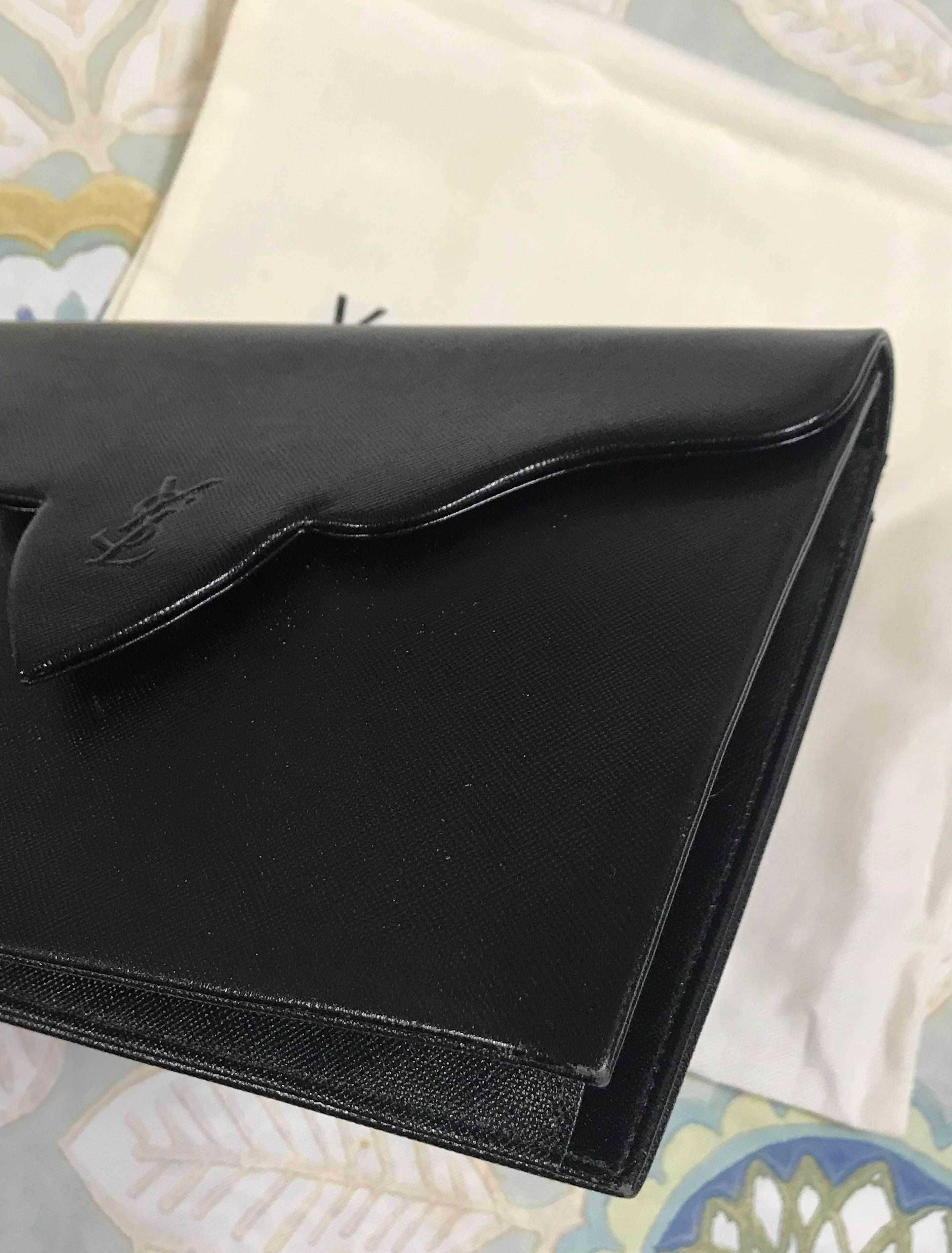 Women's Vintage Yves Saint Laurent genuine black leather clutch purse with beak tip flap