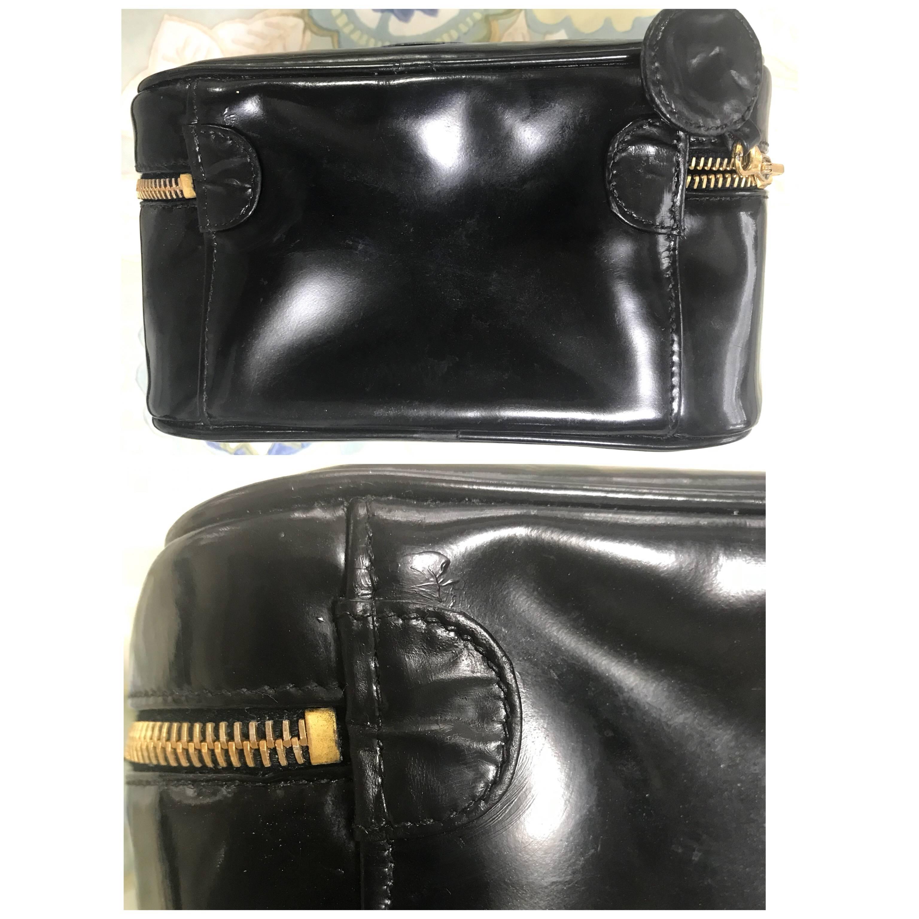 Black Chanel Vintage patent enamel cosmetic and toiletry black pouch purse with CC. For Sale
