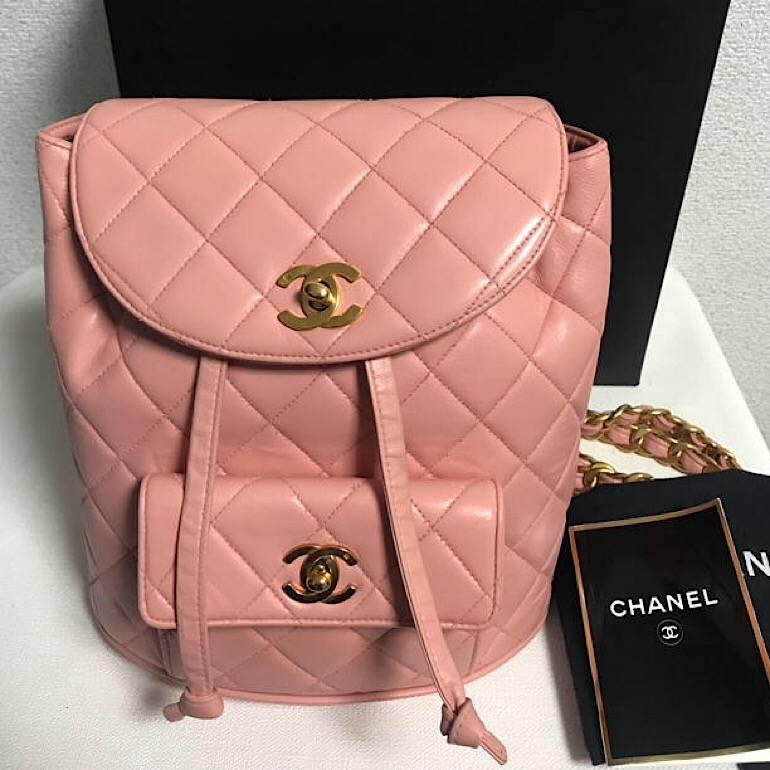 1990s. Vintage CHANEL quilted pink lamb leather backpack with golden chain straps and CC closure. Classic and popular bag. Must have.

Here is another one of the most popular vintage lamb leather bag from CHANEL, pink backpack with gold tone CC