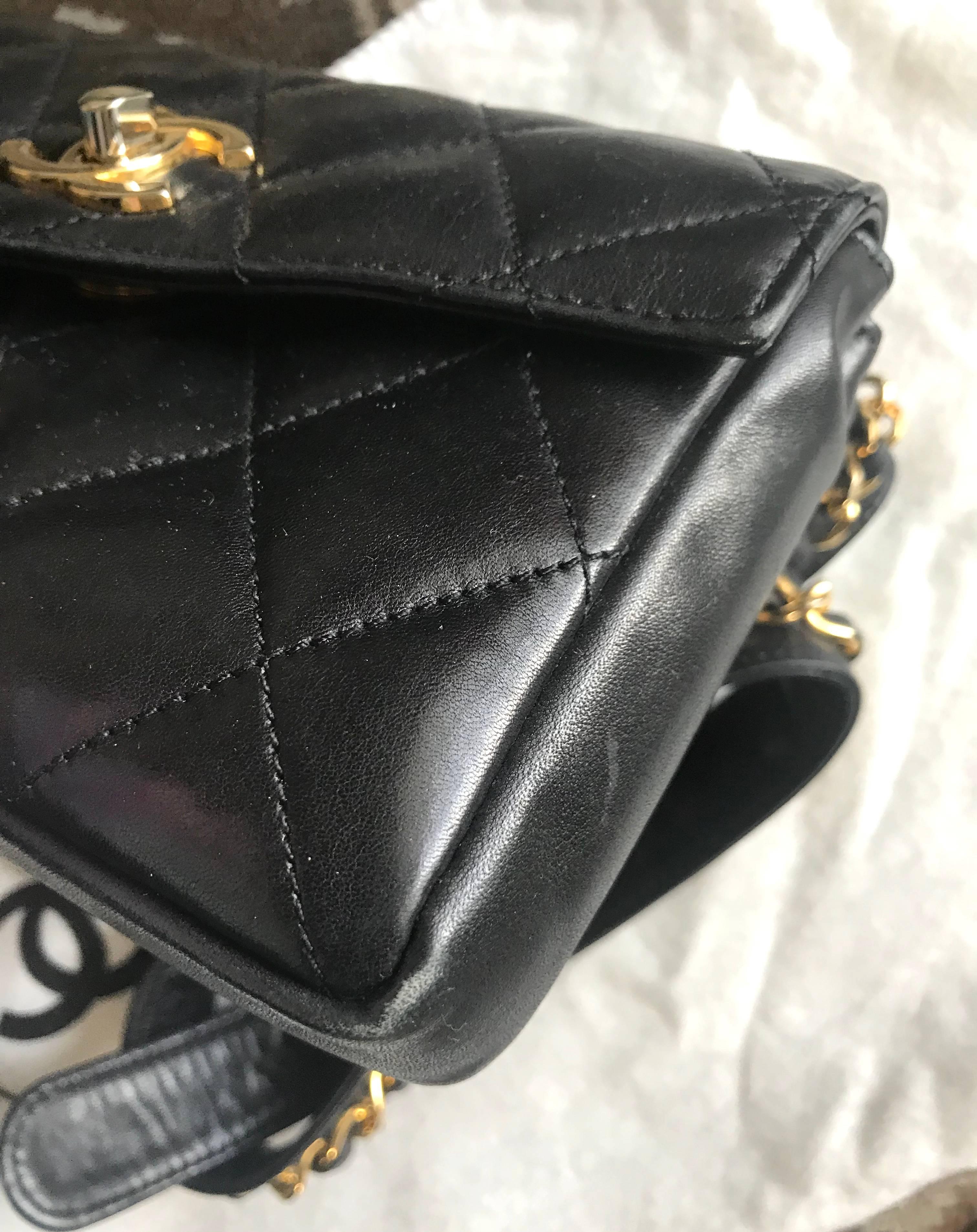 Black Vintage CHANEL black lamb waist bag, fanny pack with golden chain belt & CC.