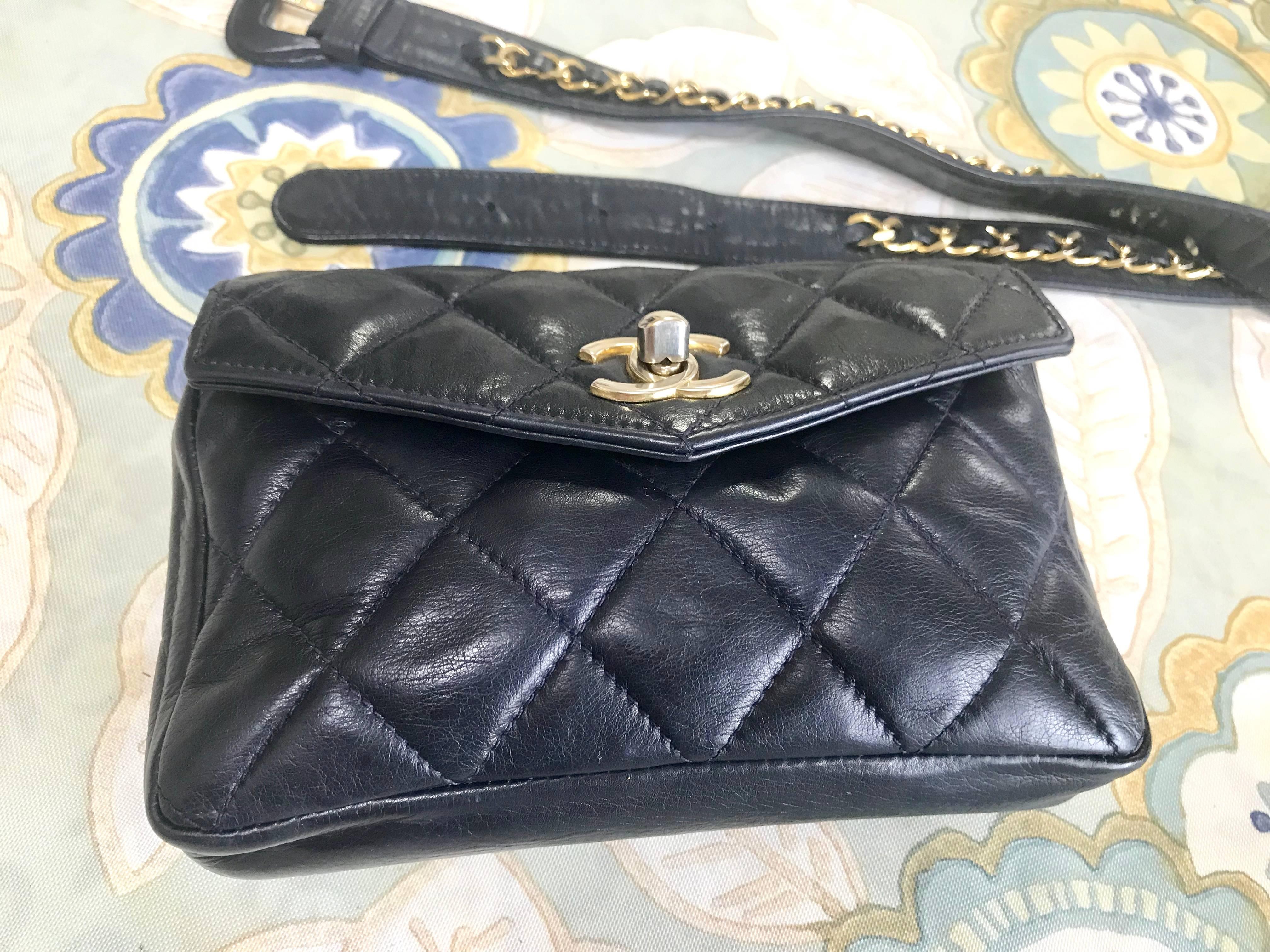 Women's Chanel Vintage navy lamb waist bag fanny pack with golden chain belt and CC. For Sale