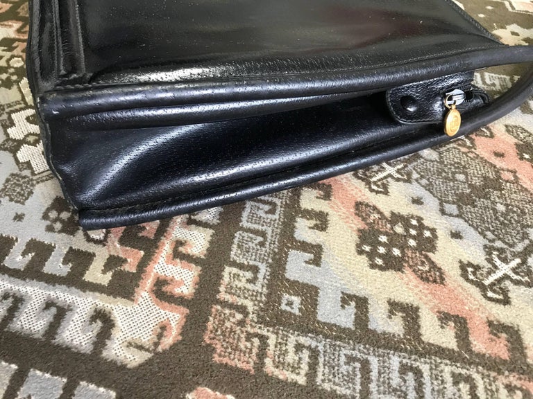 Vintage Gucci Black Pigskin Large Trapezoid Shape Shoulder Bag with Embossed GG Mark. Classic Leather Purse for Daily Use.