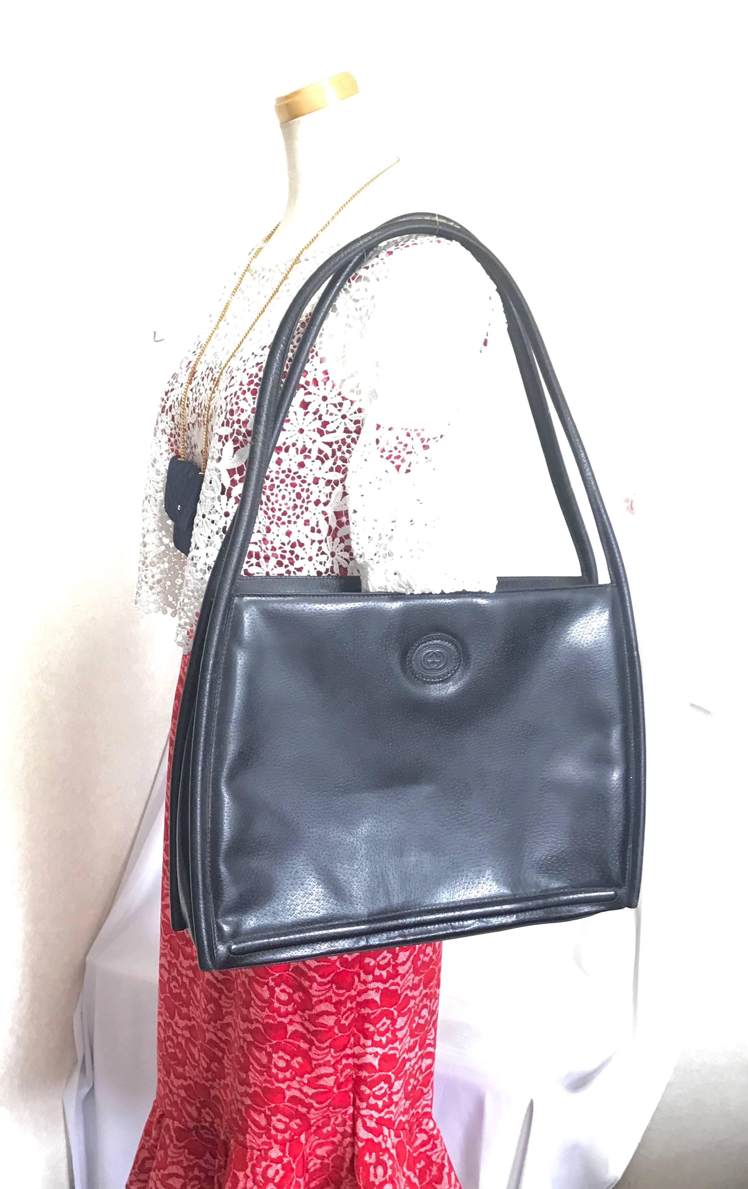 Vintage Gucci black pigskin large trapezoid shape shoulder bag with embossed GG. For Sale 5