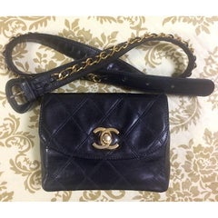 Vintage CHANEL black leather waist purse, fanny pack with golden chain belt.
