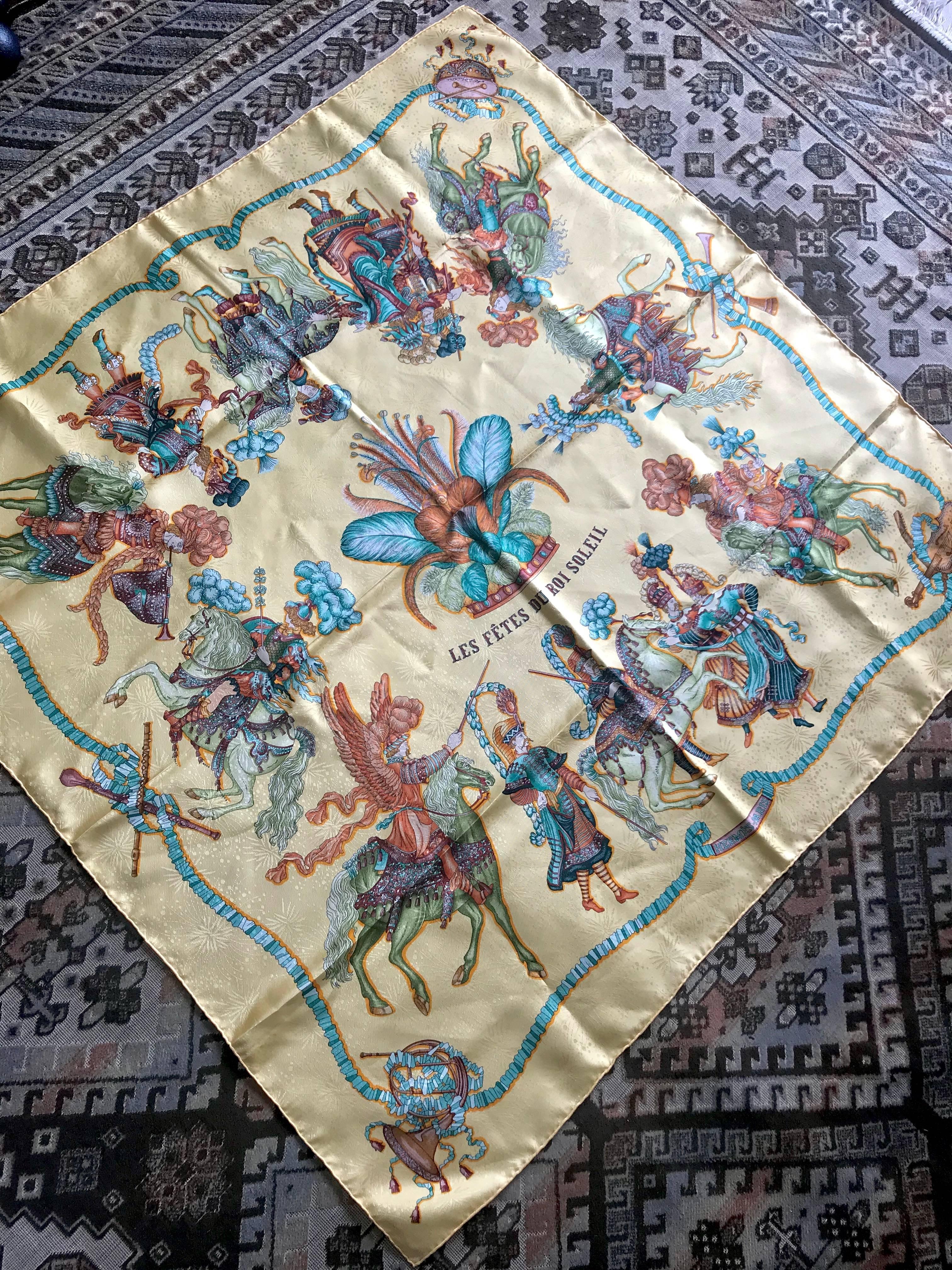 MINT/Beautiful condition! Don't miss...

1990s. Vintage HERMES Carre large silk scarf with cream yellow, blue and brown print. Best foulard.  LES FETES DU ROI SOLEIL.  Classic foulard. Perfect gift idea. 

This is a 100% twill, large size silk Carre