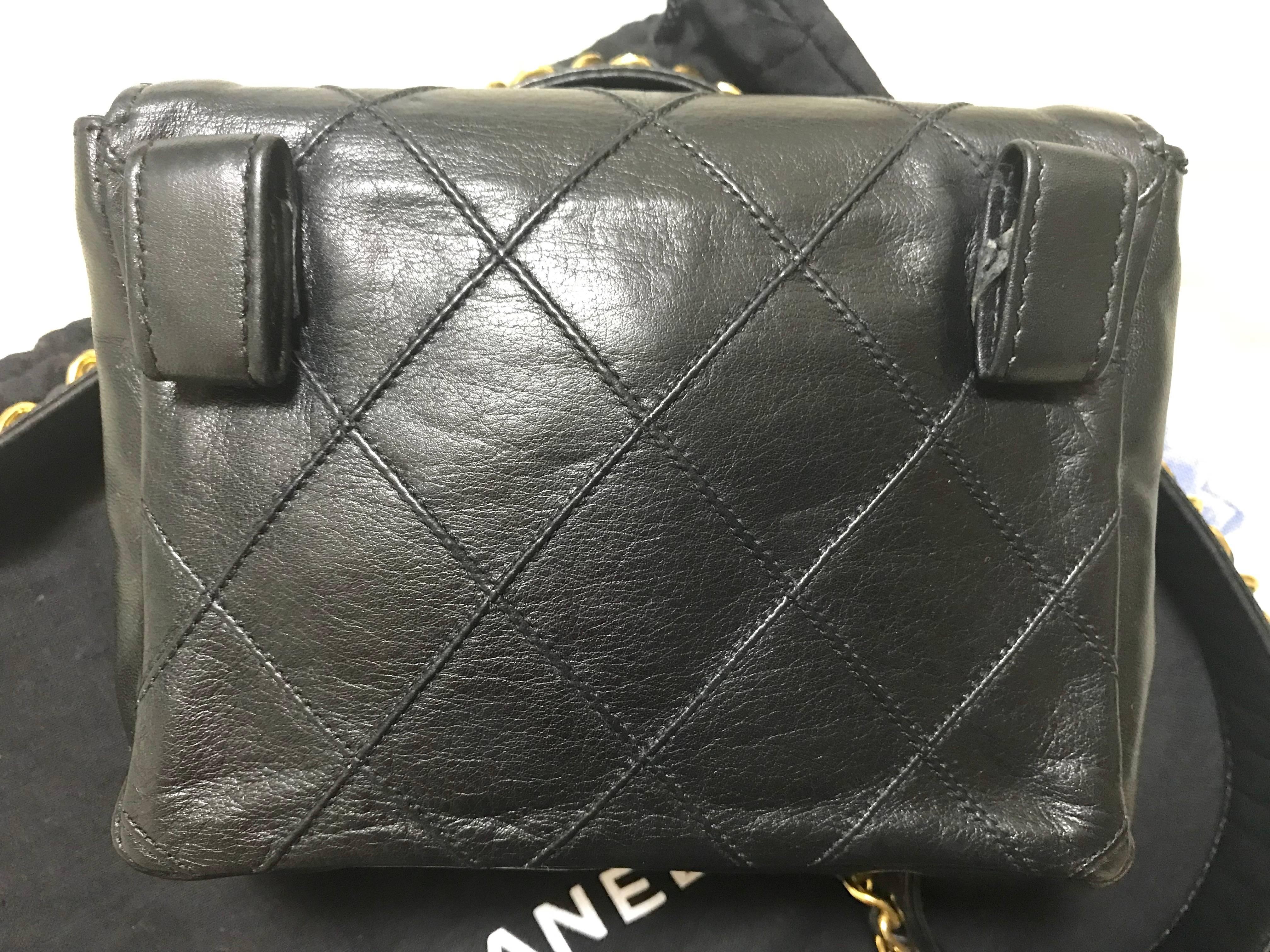 Women's Vintage CHANEL black leather waist purse, fanny pack, hip bag with golden CC.