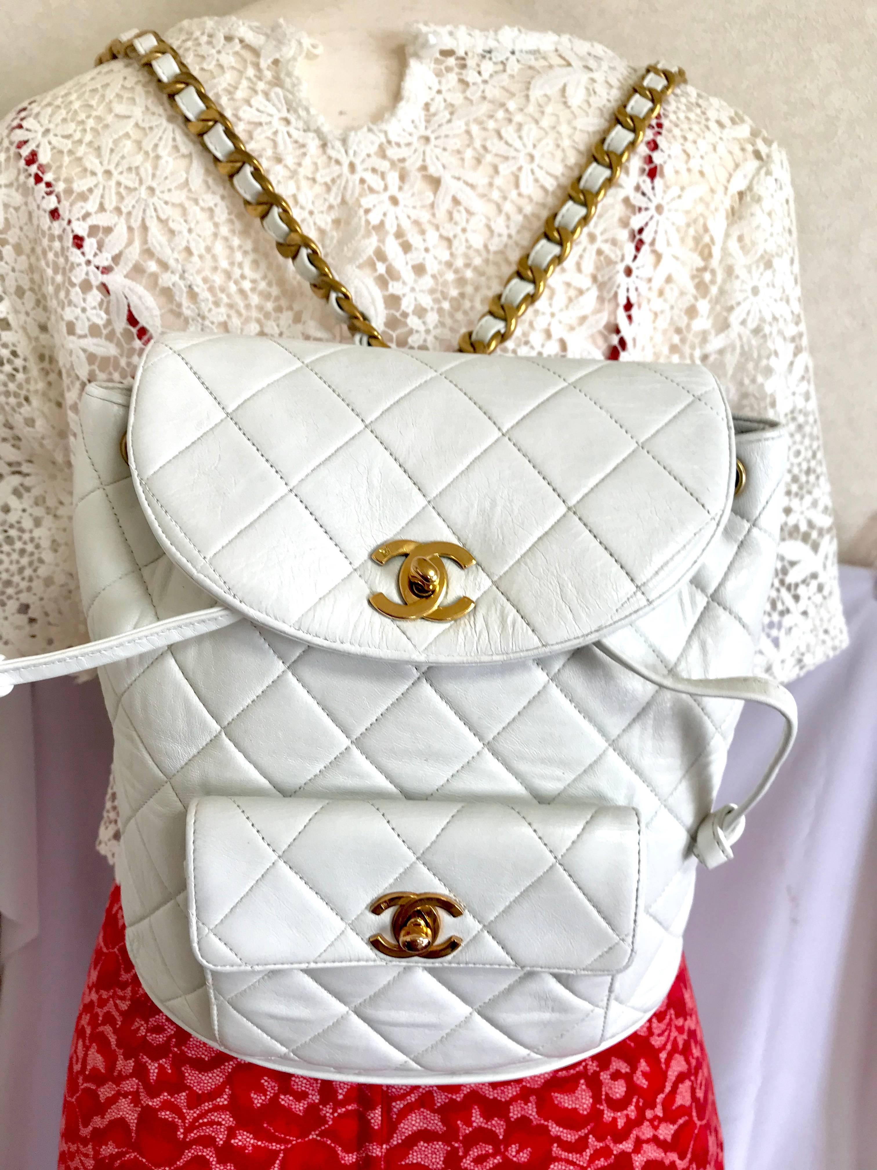 1990s. Vintage CHANEL quilted white lamb leather backpack with golden chain straps and CC closure. Classic and popular bag. Must have.

Here is another one of the most popular vintage lamb leather bag from CHANEL, classic but rare color, white