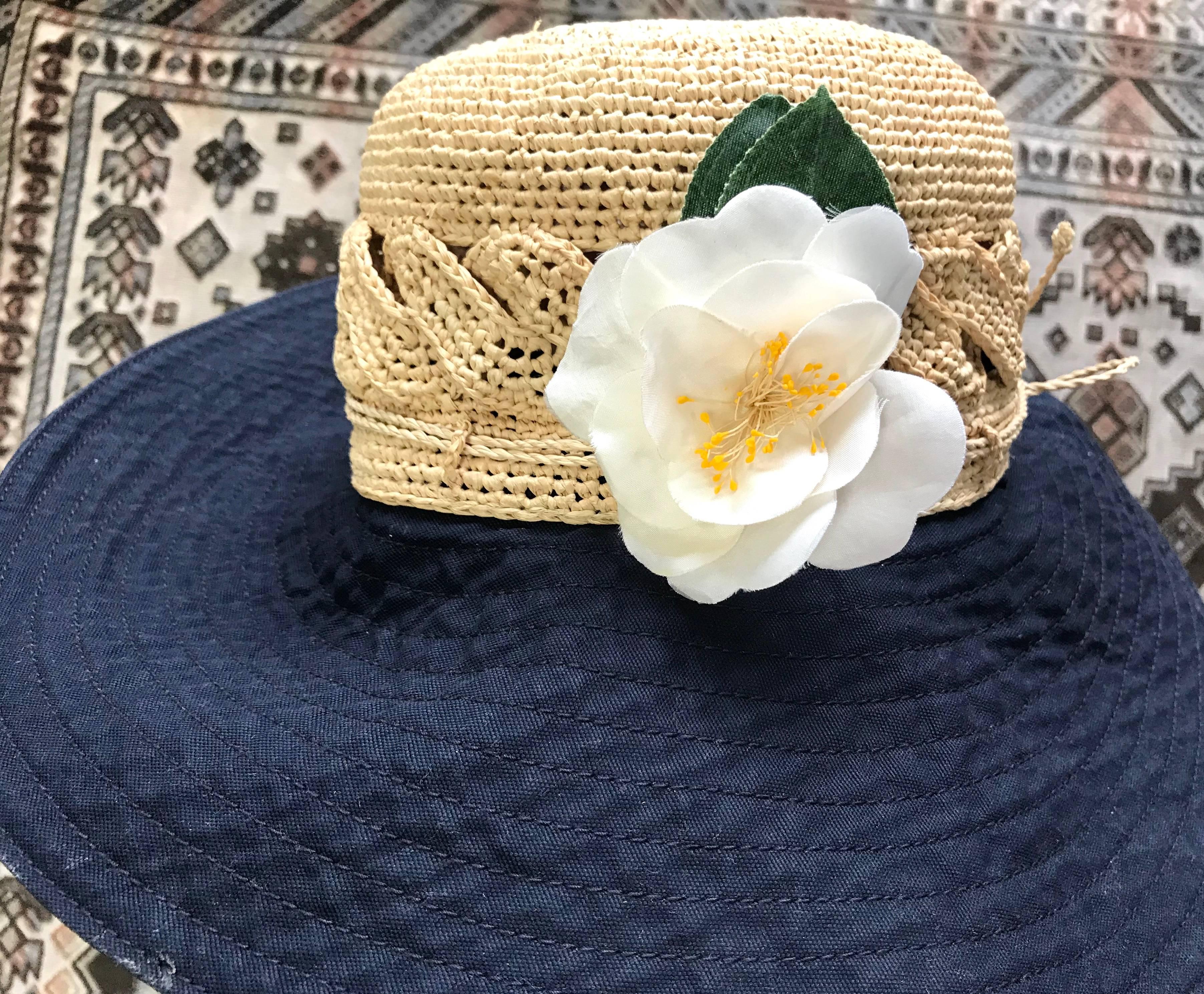 Chic Chanel vintage 1990's signature camellia white ivory silk brooch w/green leaves

Though there are partially water stains seen on some of the petals, overall, it is still in a good vintage condition without major or noticeable damages.

Made in