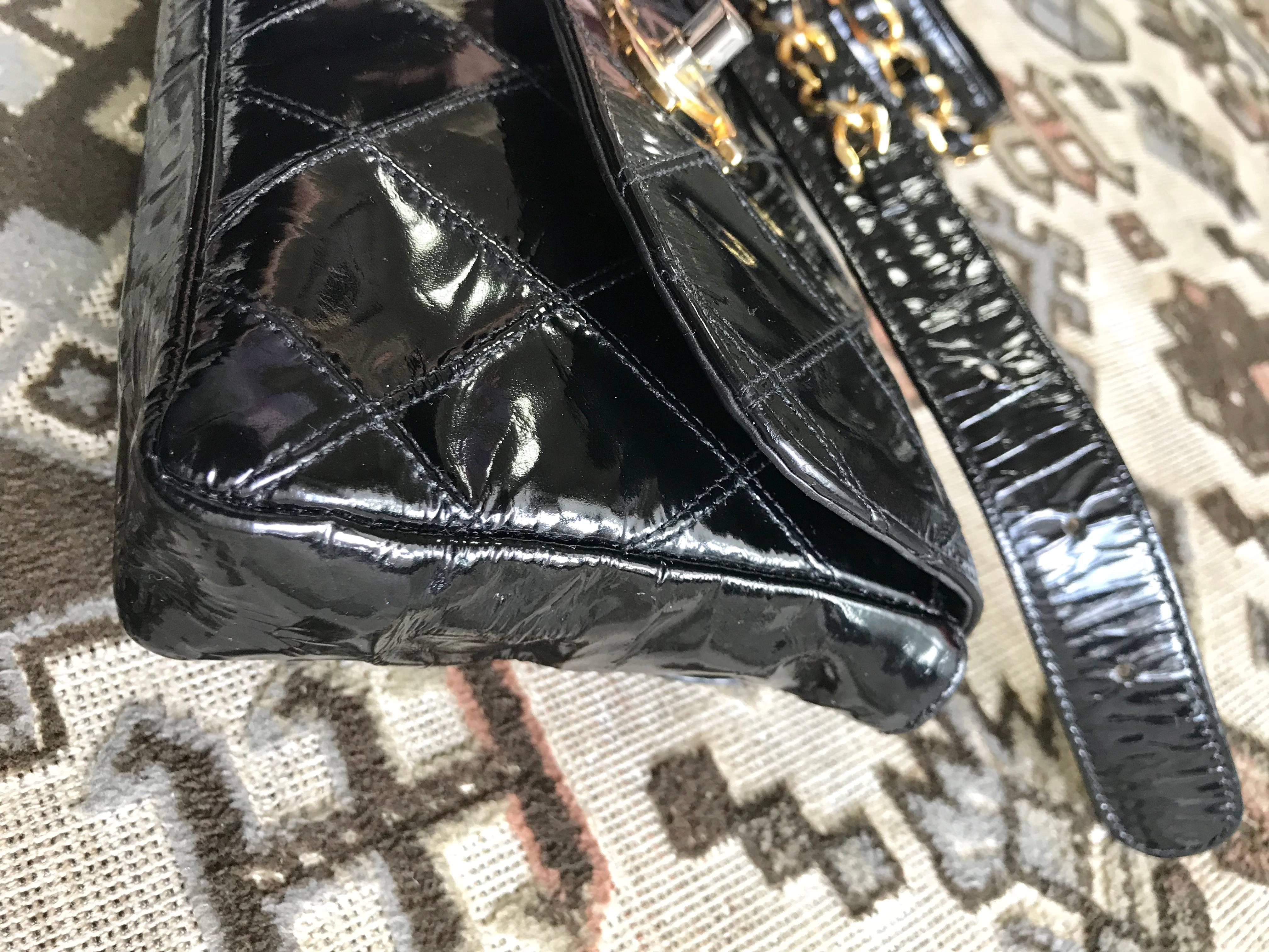 Women's Vintage CHANEL black patent enamel belt bag, fanny pack with CC closure.