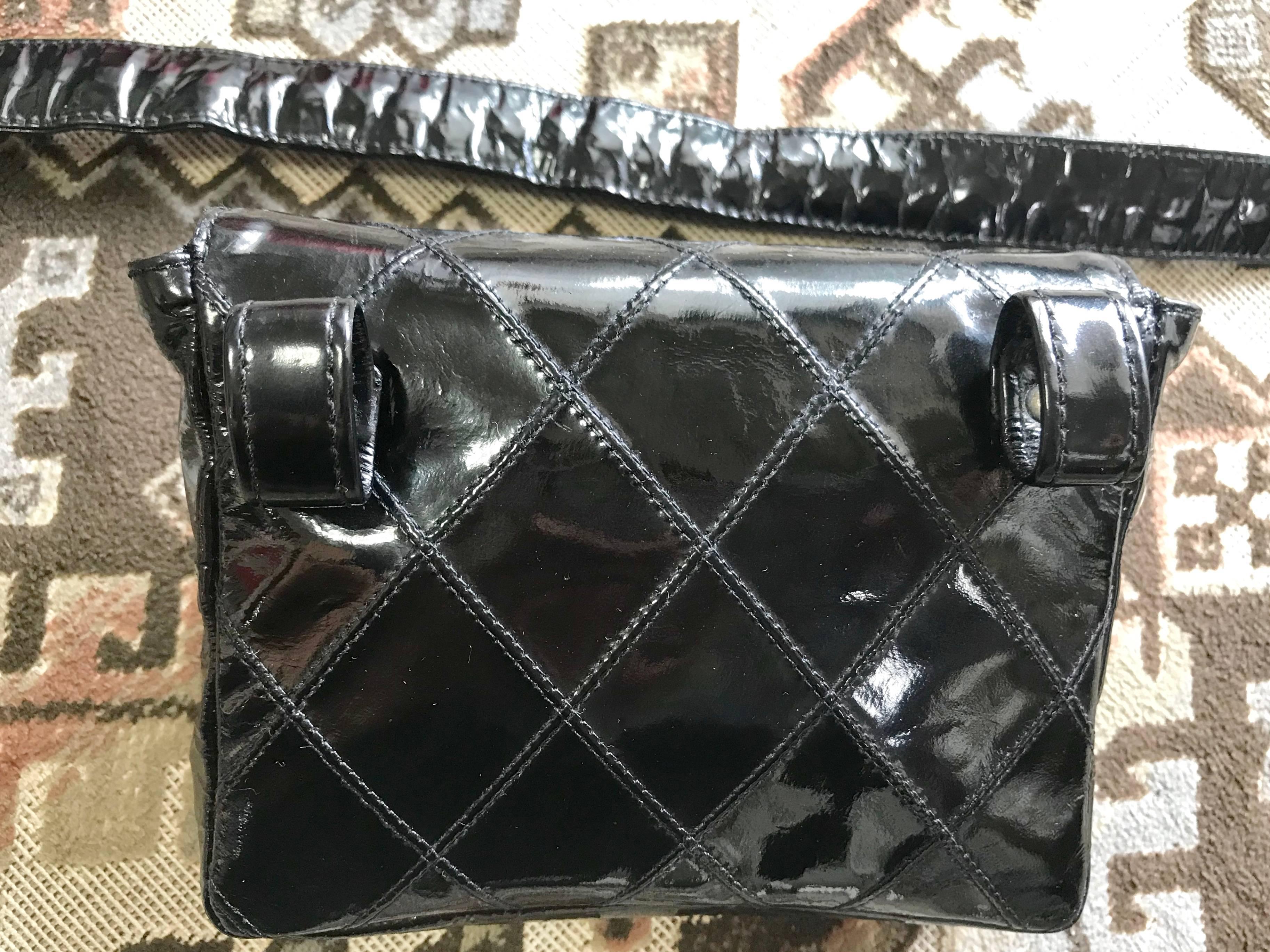Black Vintage CHANEL black patent enamel belt bag, fanny pack with CC closure.